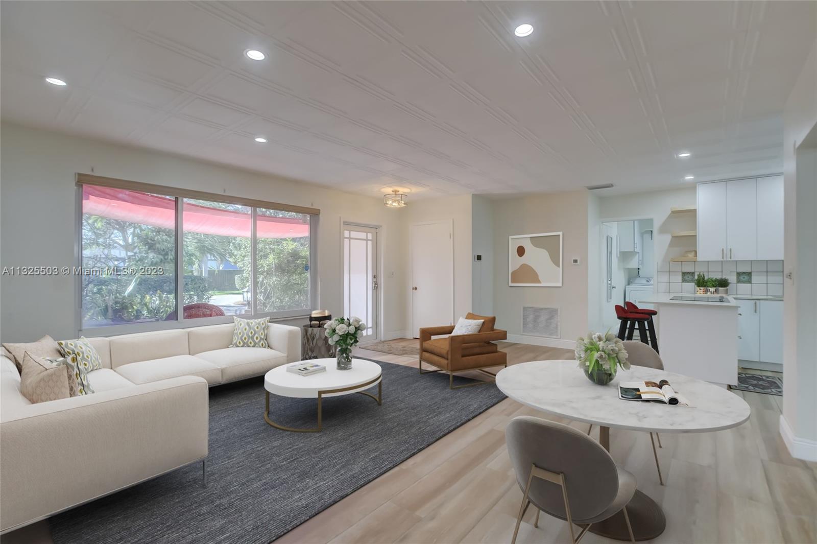 Towering Royal Poincianas greet you as you enter onto your newly pavered driveway.