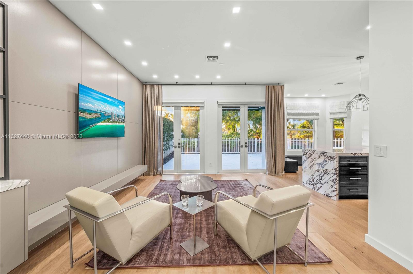 Den looking out to Pool & deck