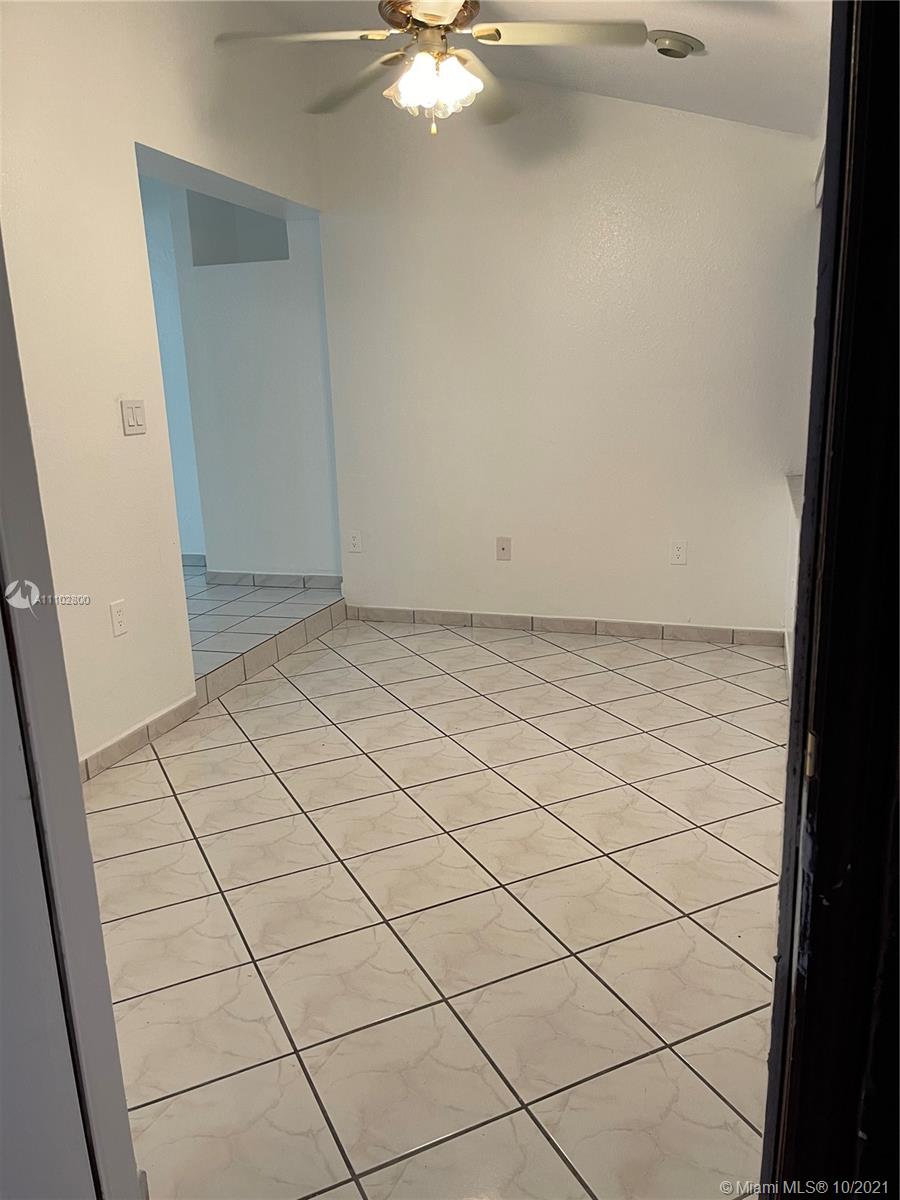 foyer that connects the entrance to the living room