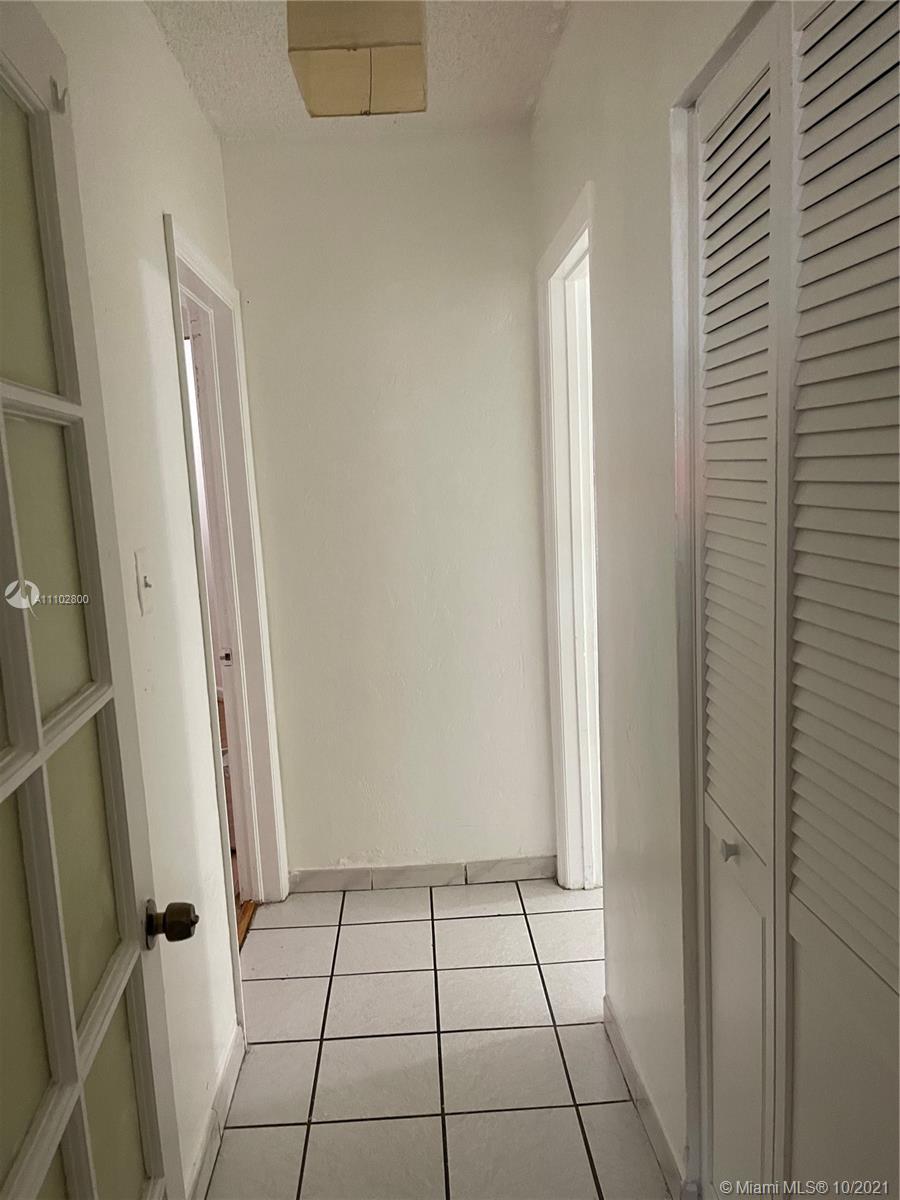 hallway access from bathroom to 3rd bedroom.