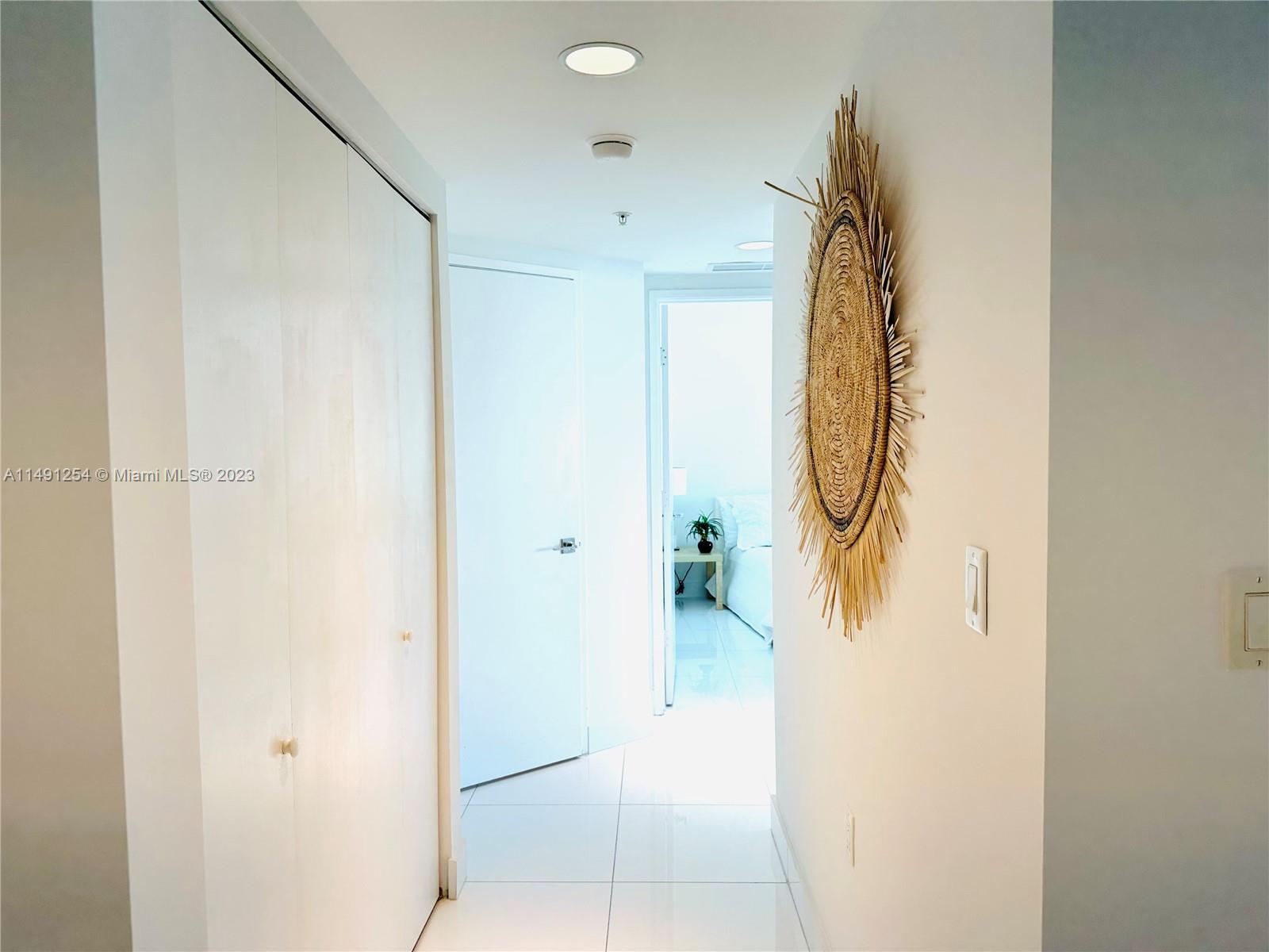 HALLWAY W/LAUNDRY CLOSED & TO BEDROOMS