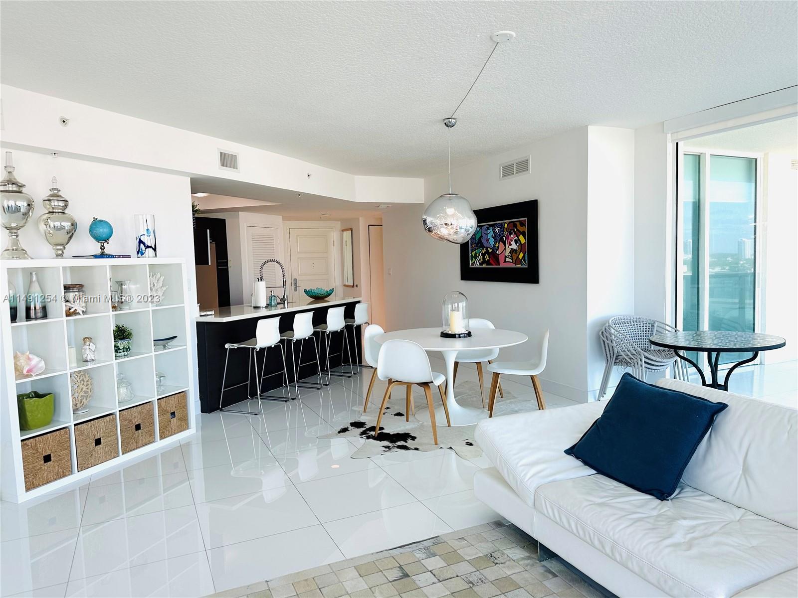 VIEW FROM LIVING AREA TO KITCHEN COUNTER SEATING AREA