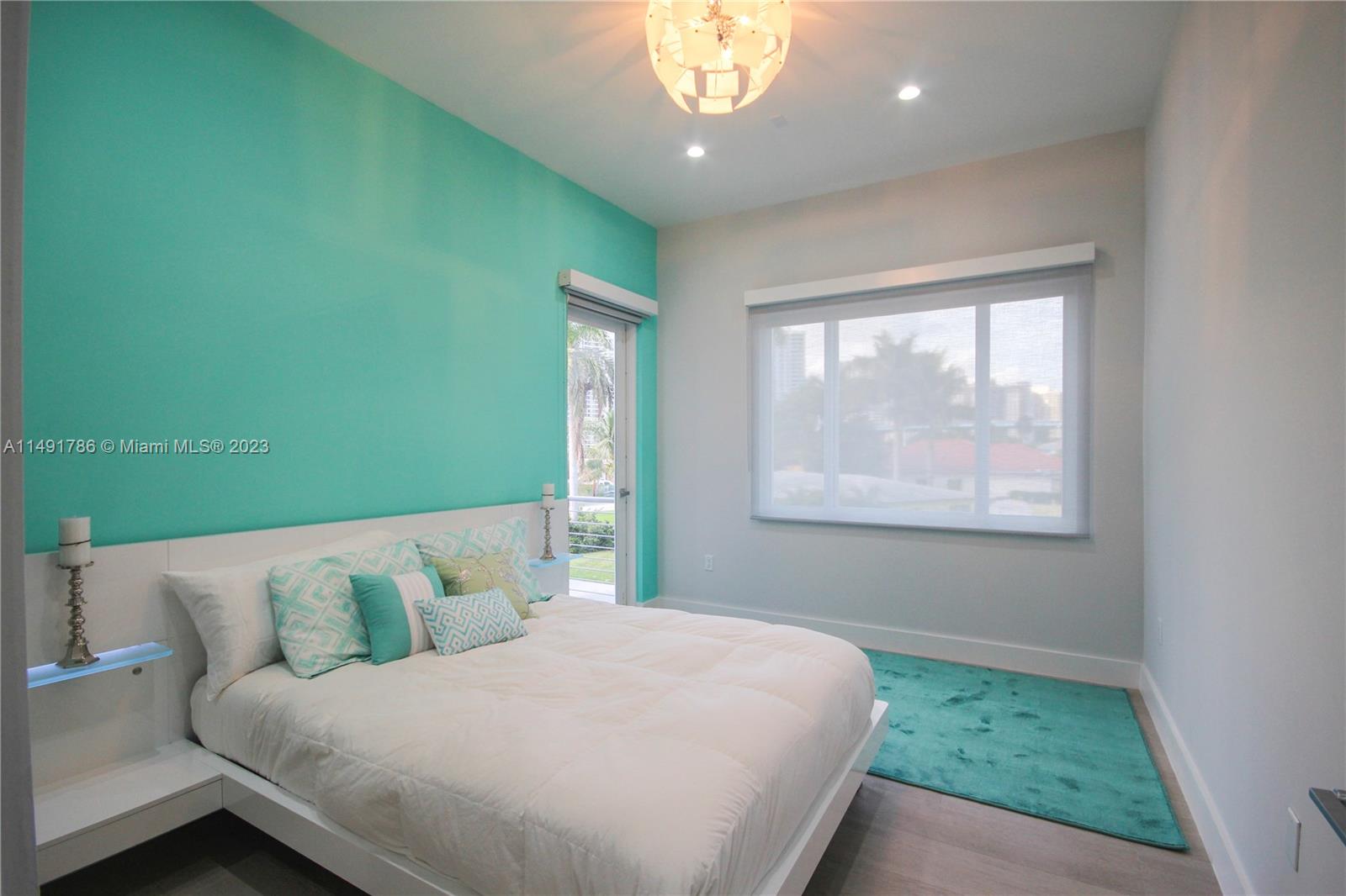 Upstairs third bedroom with balcony.