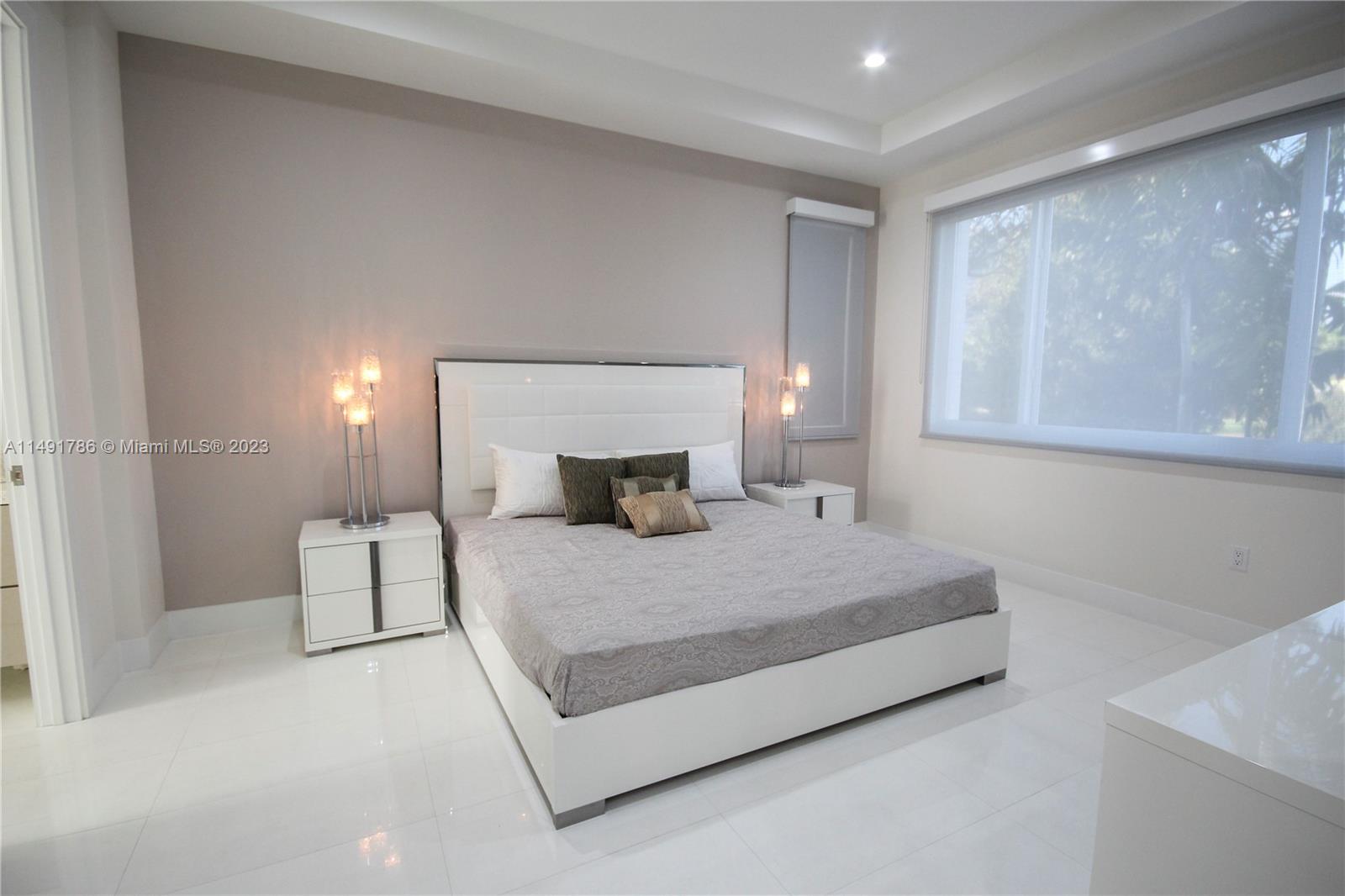 First floor guest room with bath and walk-in closet.