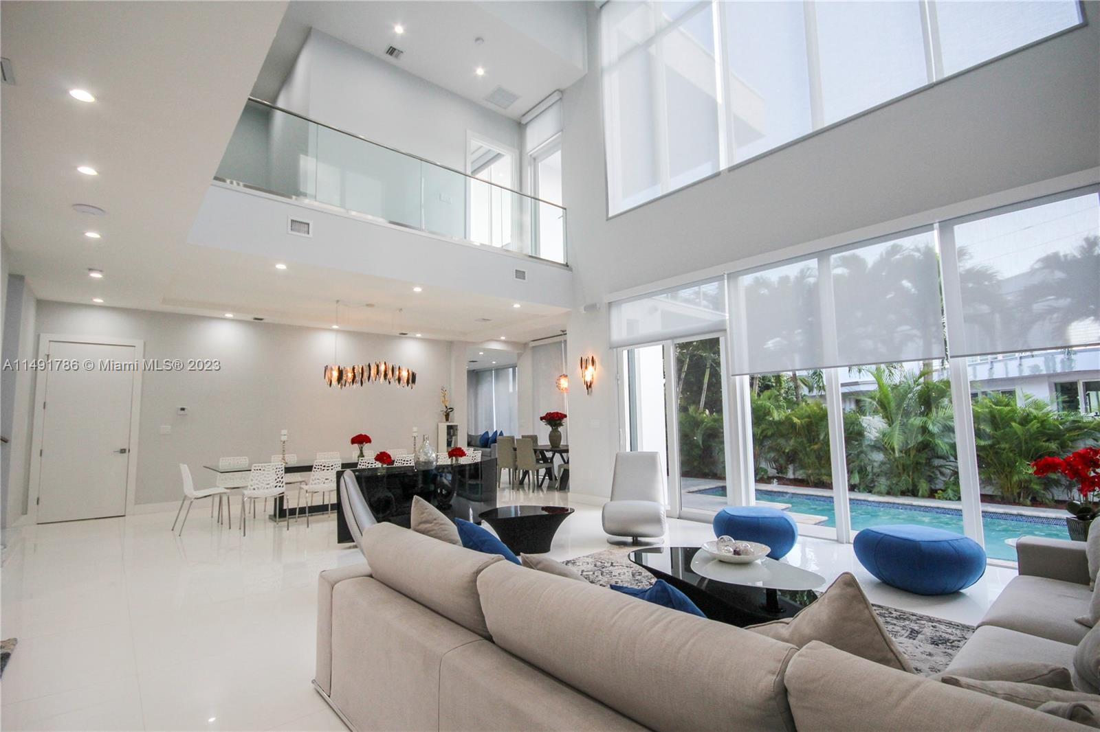 Floor to ceiling windows providing natural light throughout.