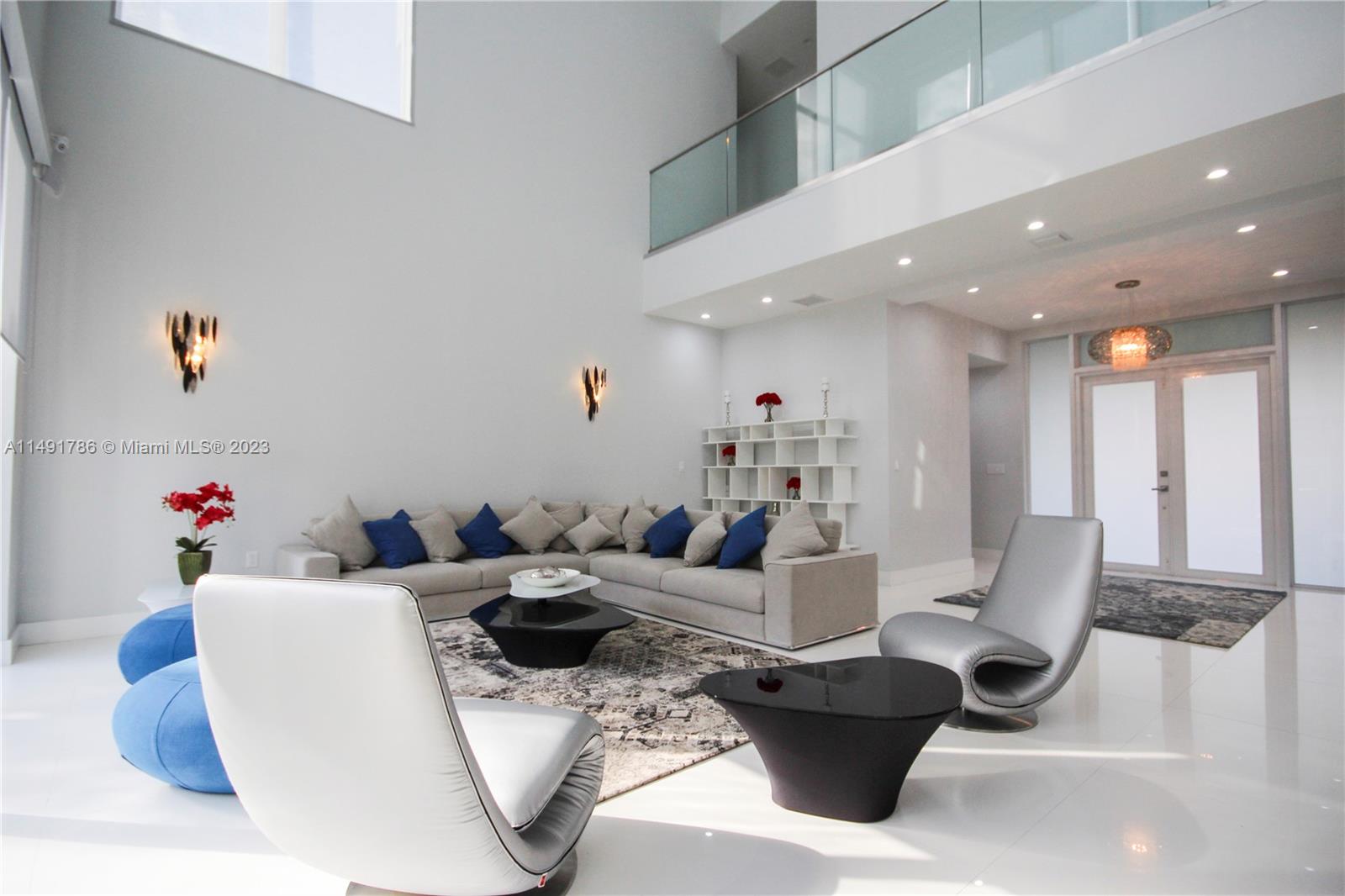 Spacious living room with 28' Ft high ceilings.