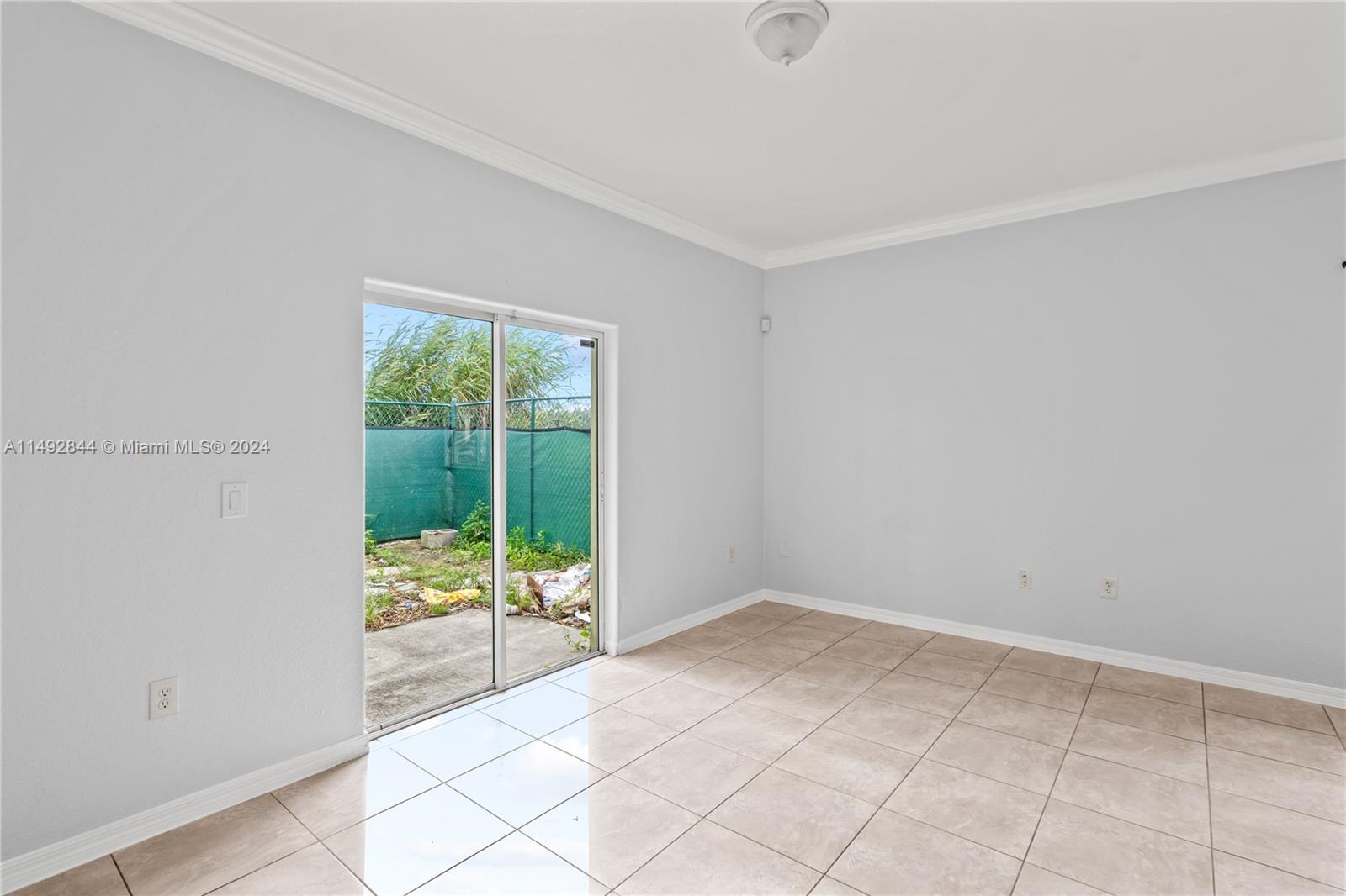 Living room with exit to the backyard.
