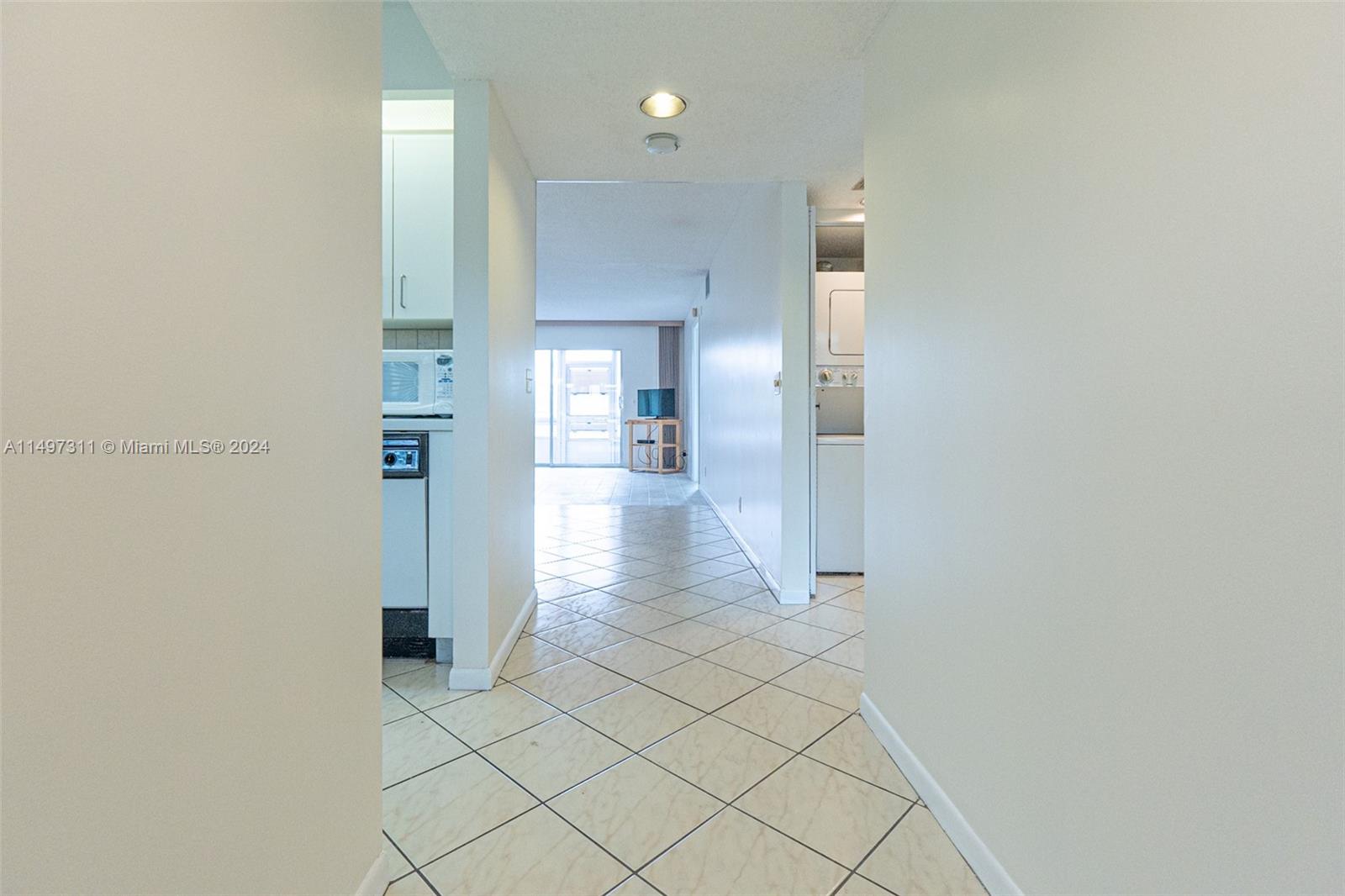 Hall Entry- Kitchen on Left- 2nd Bedroom/Bathroom/ W/D Closet