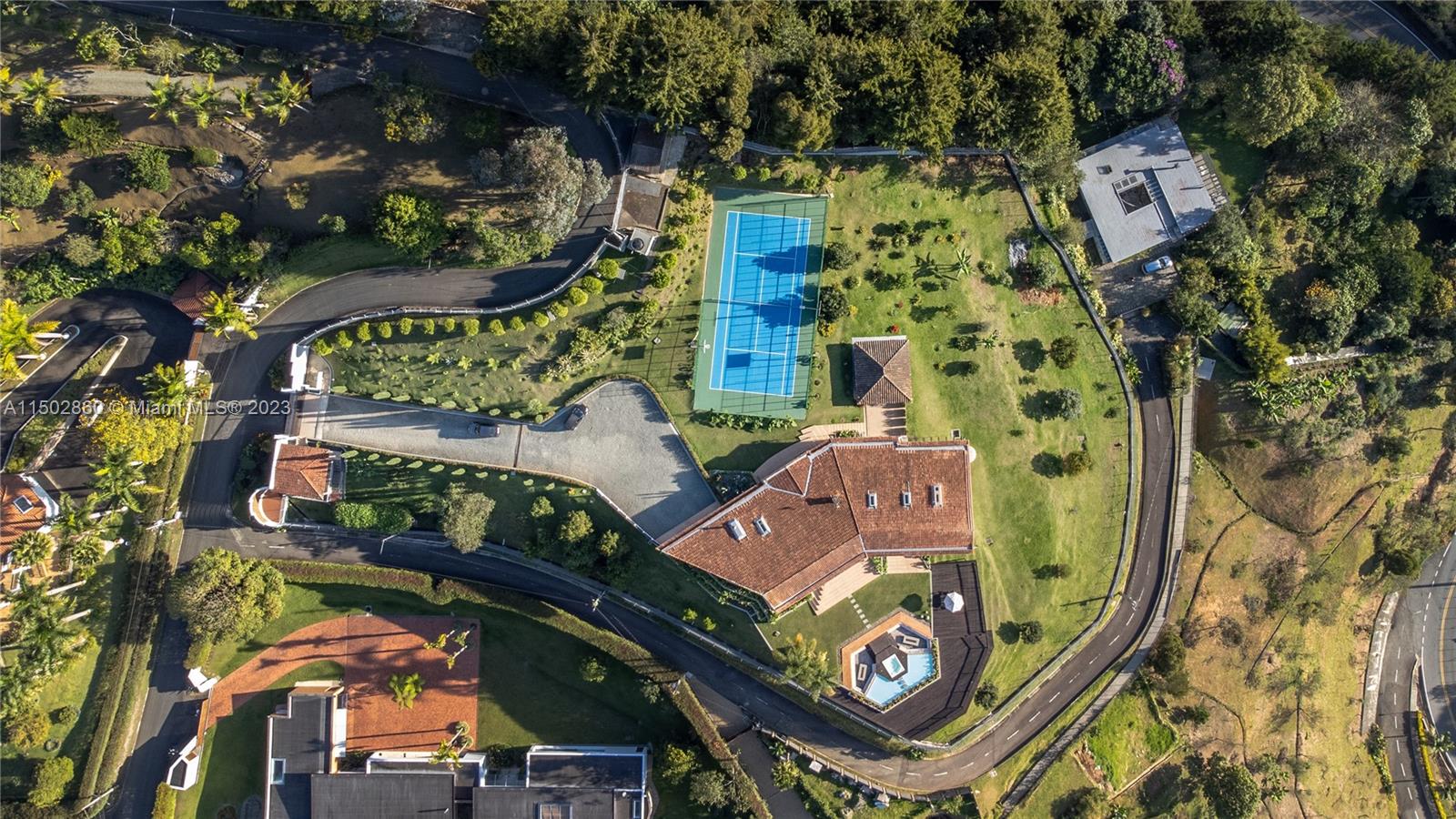 Spanning across an expansive  lot (approximately 74,304 sqf or 1,7 Acres)with 11,087 sqf living area  this estate, constructed in 2001, boasts grandeur and spaciousness.