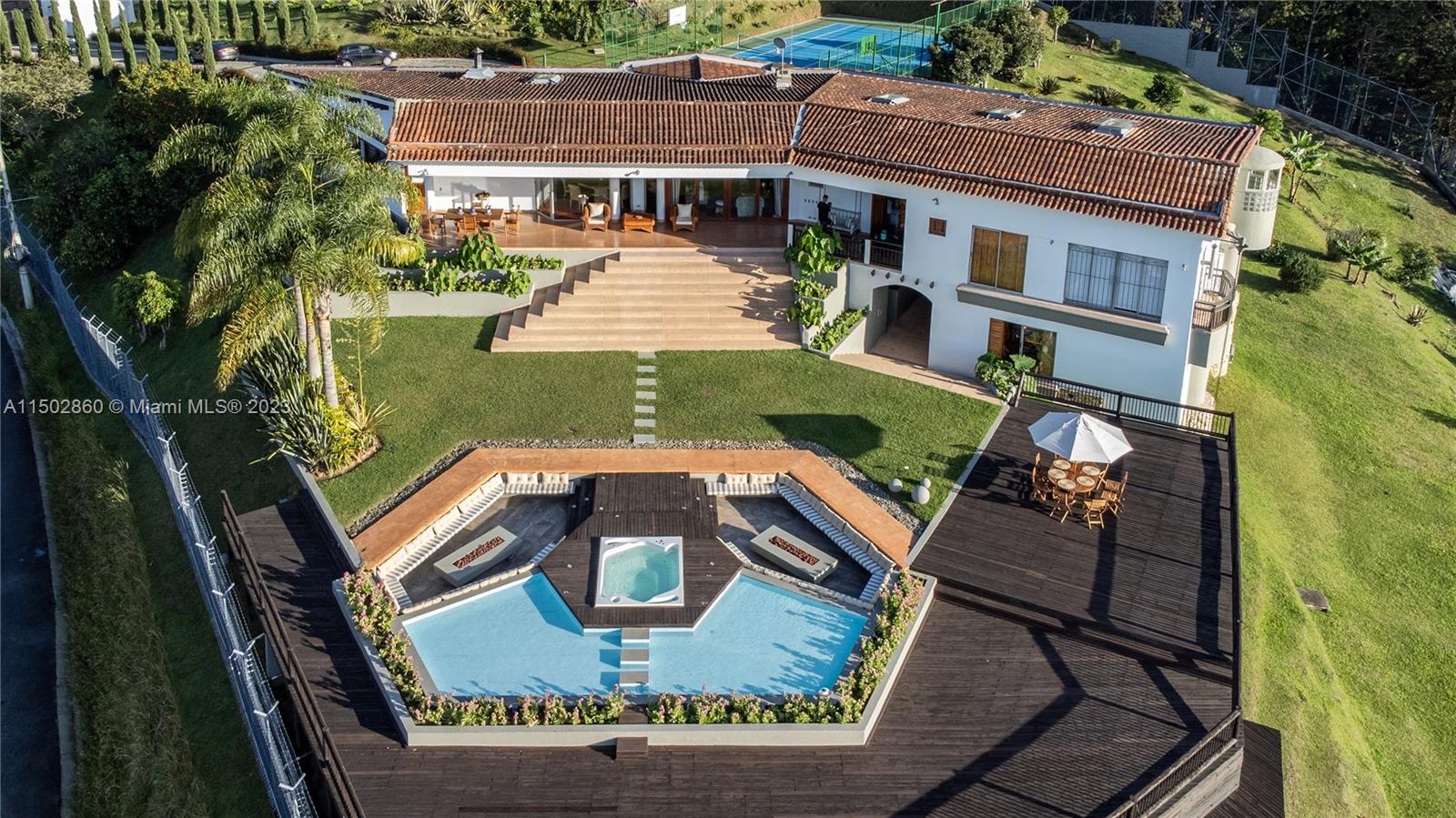 Expansive poolside decks featuring fireplaces and breathtaking vistas, creating an ideal entertainment space for gatherings with friends and family.