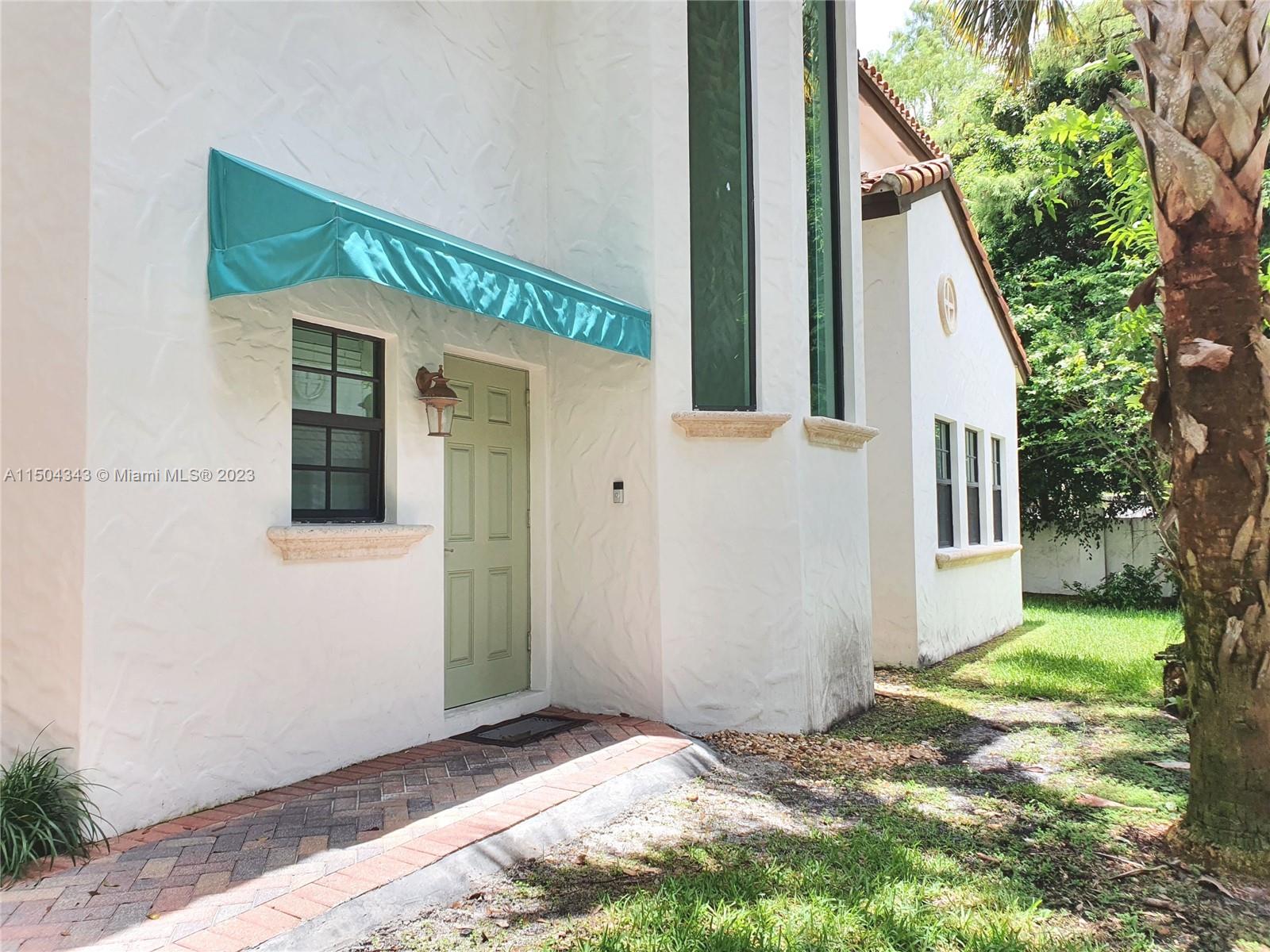 The front door is located on the side of the property.