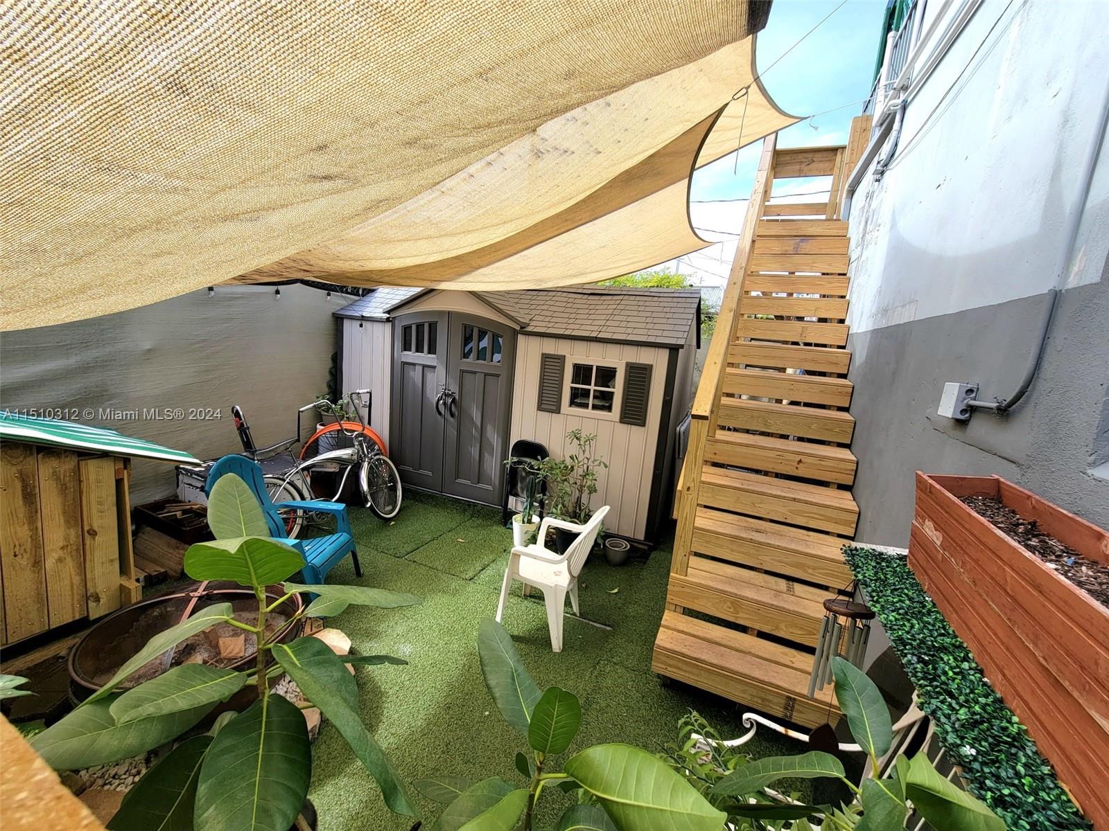 Back patio, back stairs access to 2nd floor. Used to be extra parking in rear of buidling