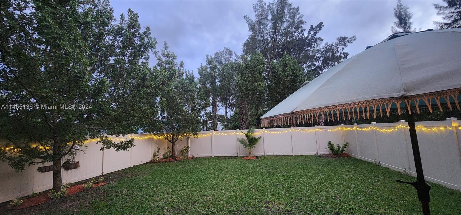 The highlight of this property is its expansive, fenced backyard, providing a safe haven for kids and pets to play freely.