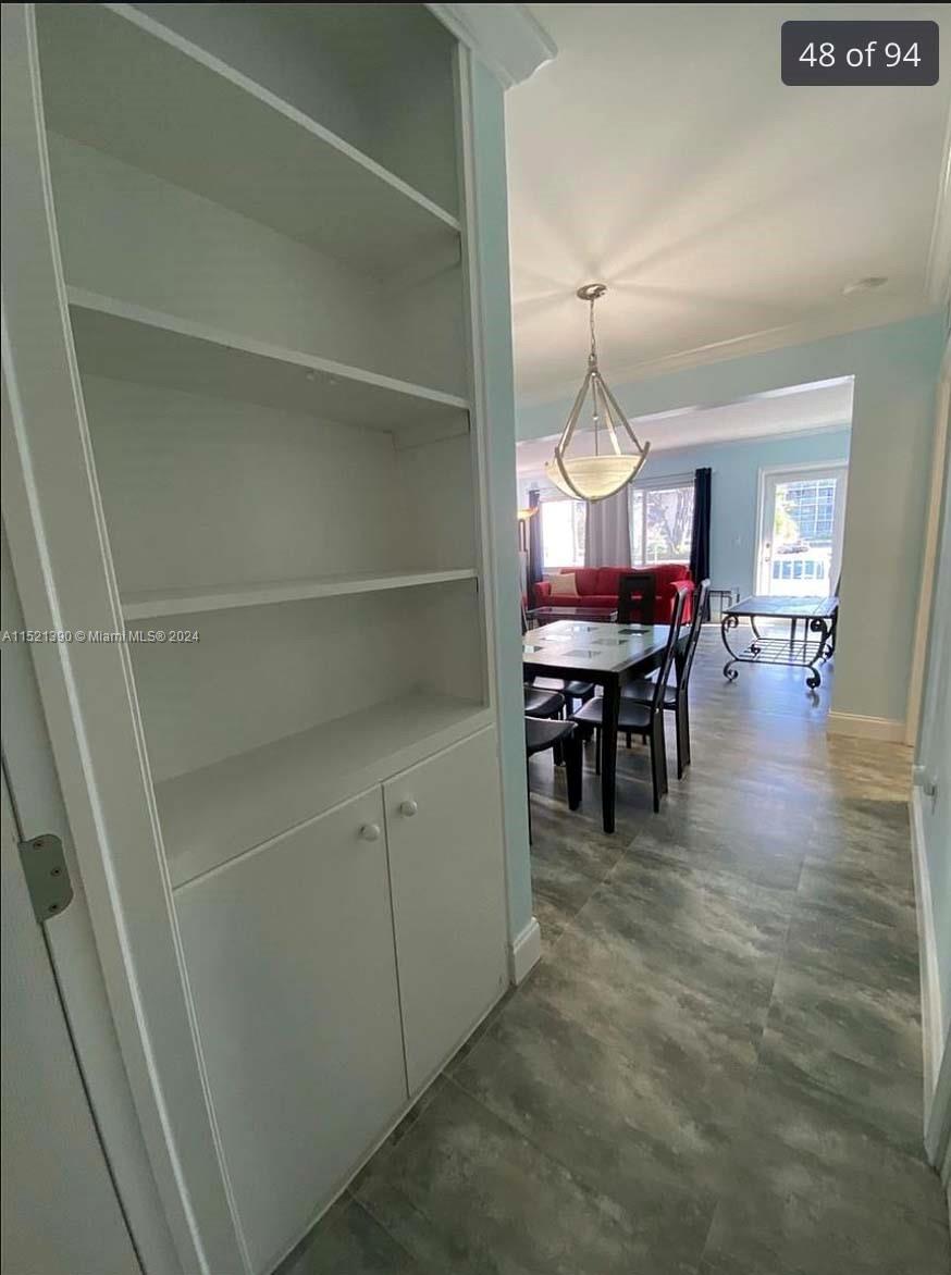 unit 1 hallway entrance to master 2 w dining view