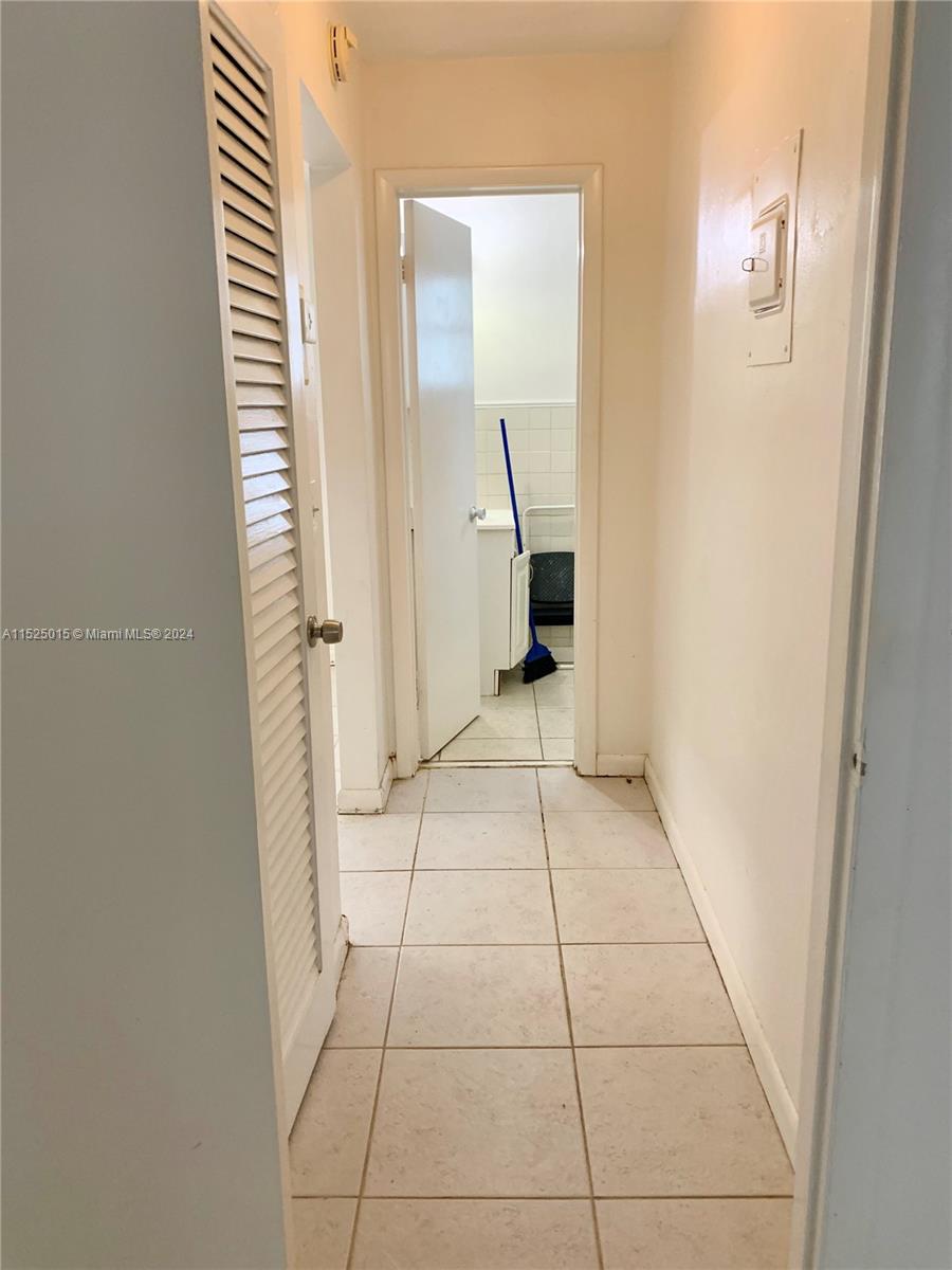 Looking down hallway to bathroom
