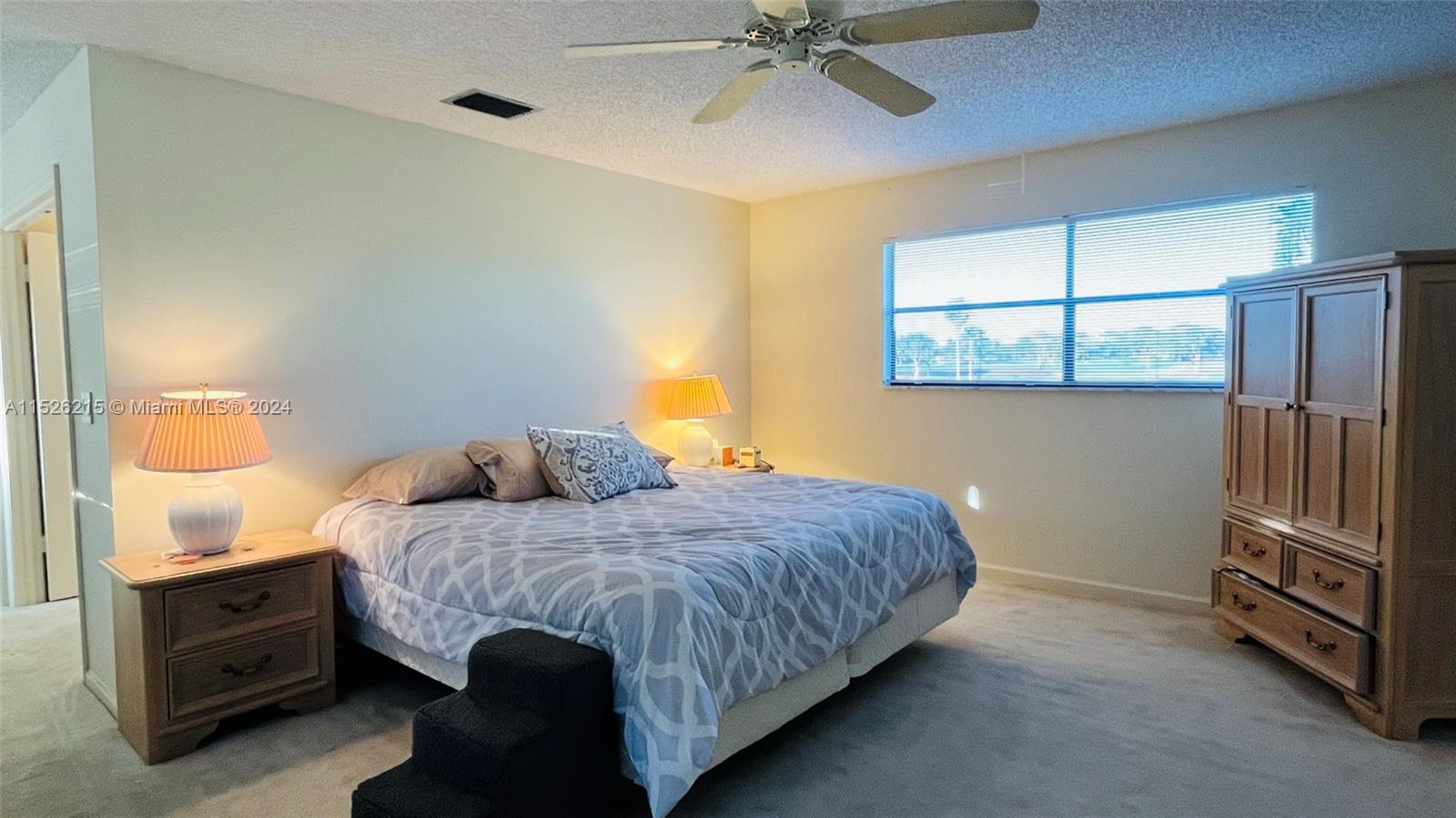  master bedroom has  its stunning views of  golf course and water view\