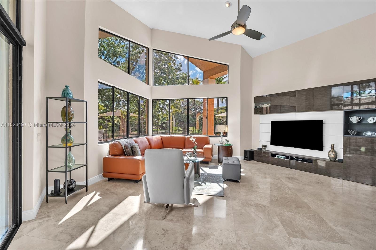 Travertine flooing throughout. Modern wall unit in your family room.