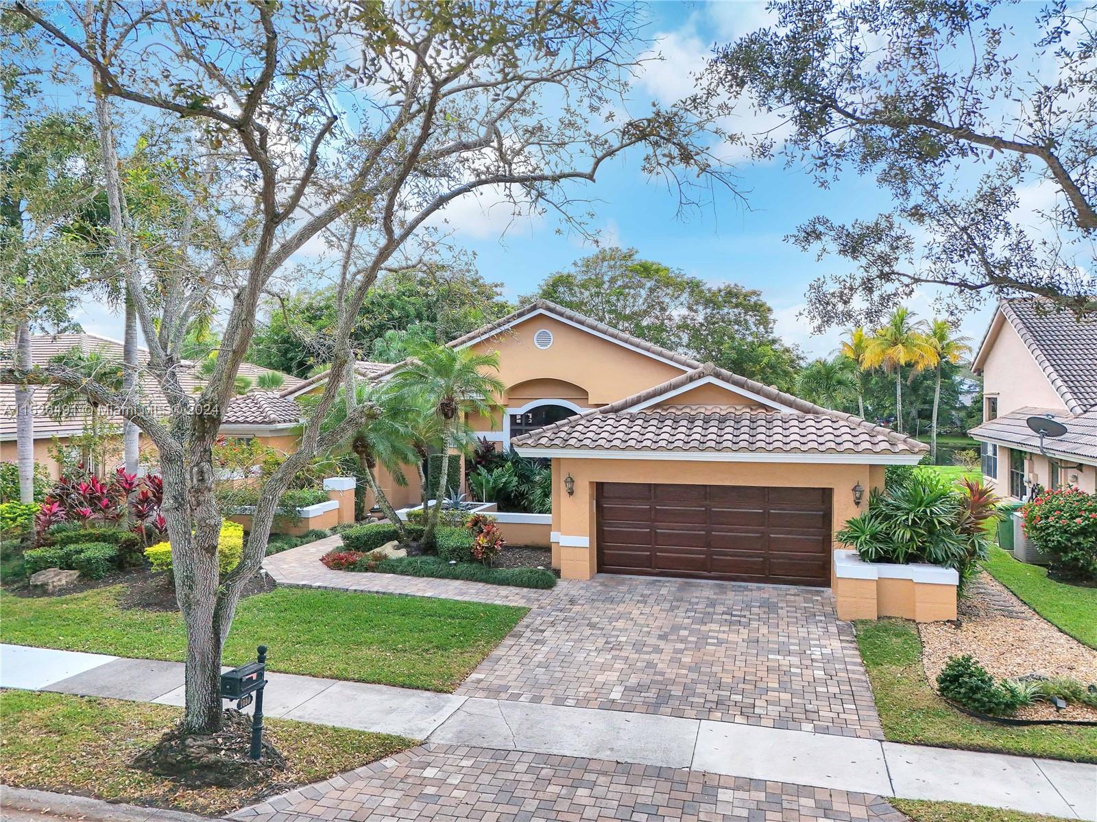 Beautiful curb appeal.
New impact front door, new pavers on driveway/walkway