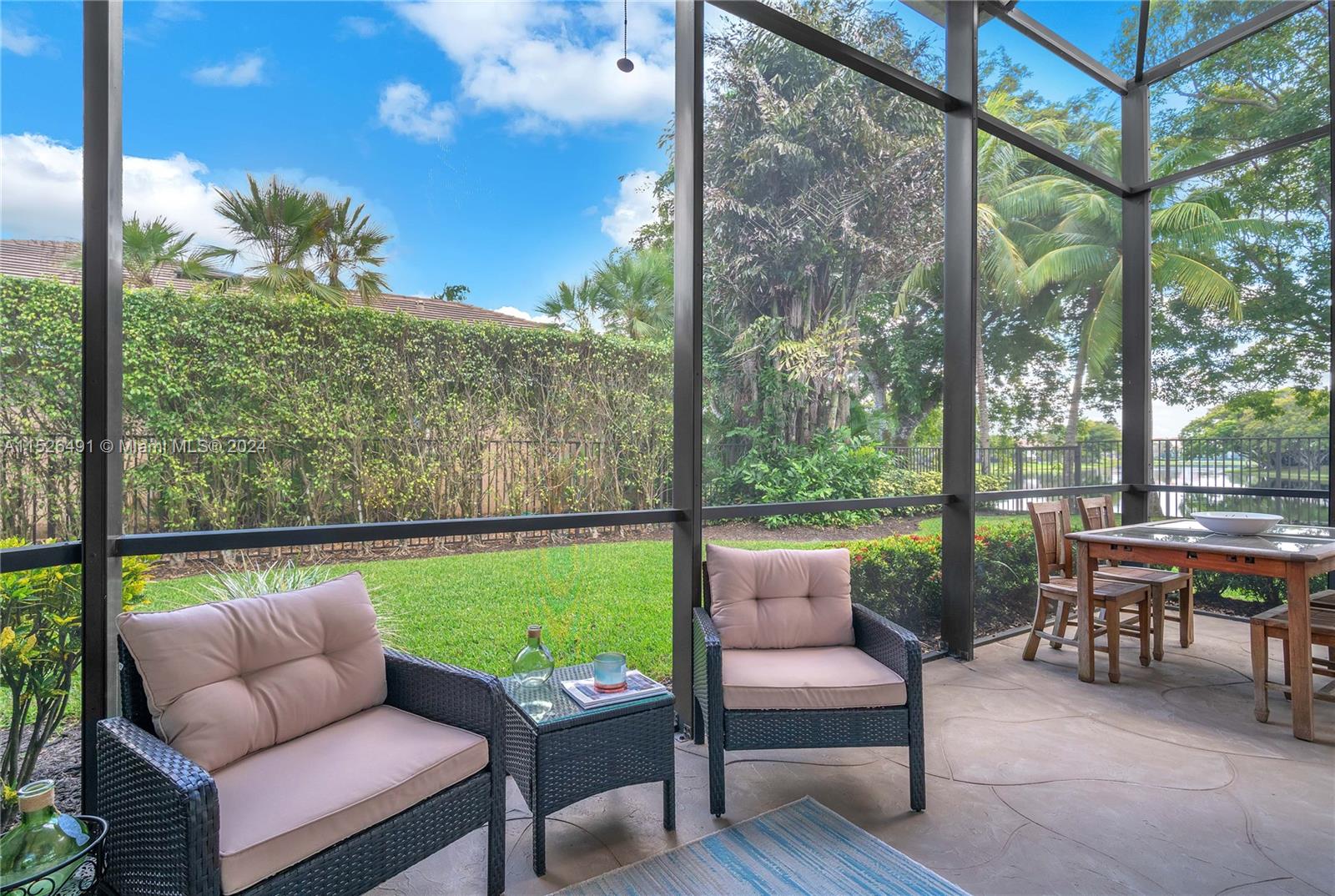 Covered screened porch creates perfect spot for dining in comfort.