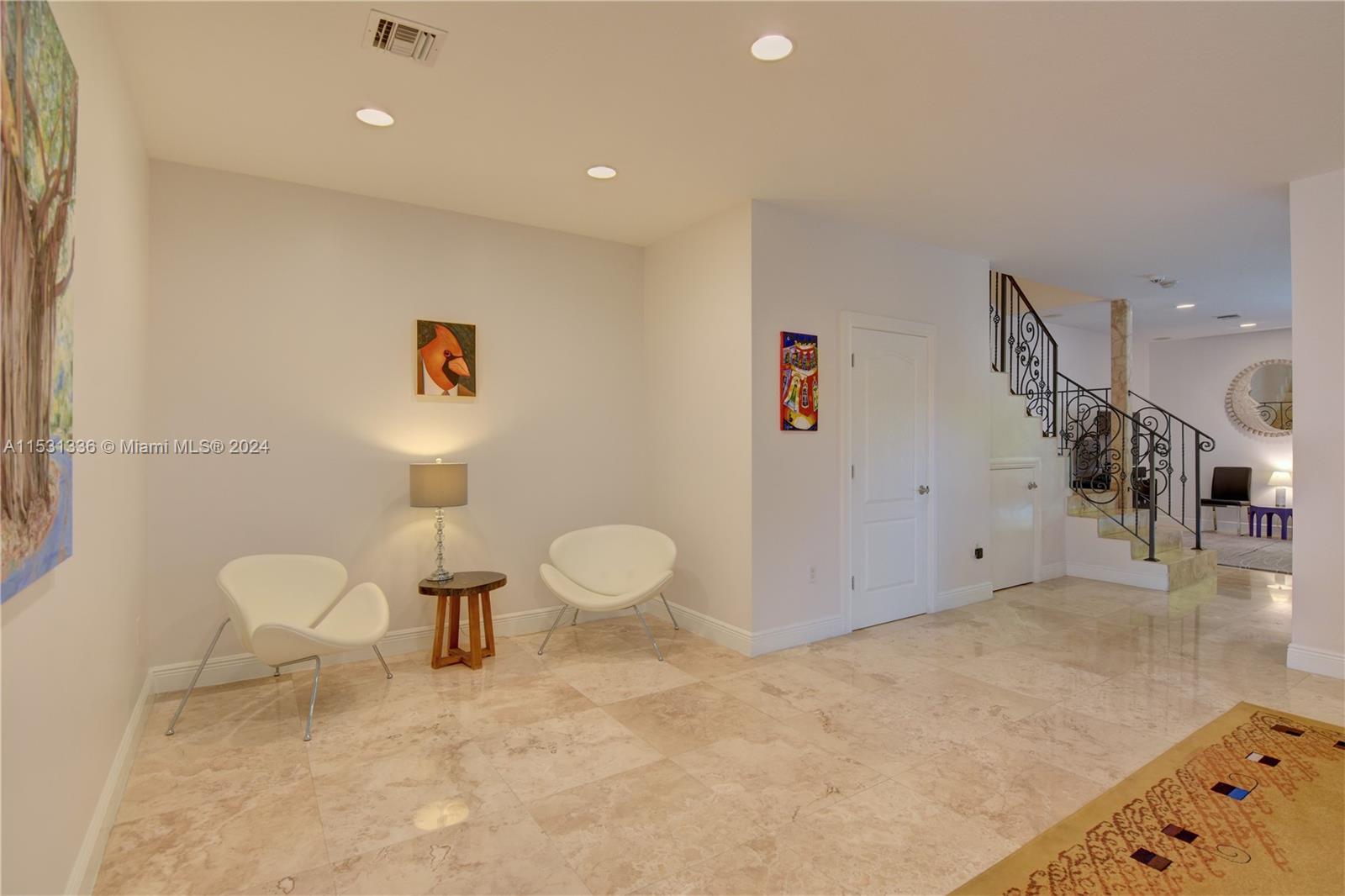 Currently being used as a living room/sitting area but it can be used as a living/dinning room area.