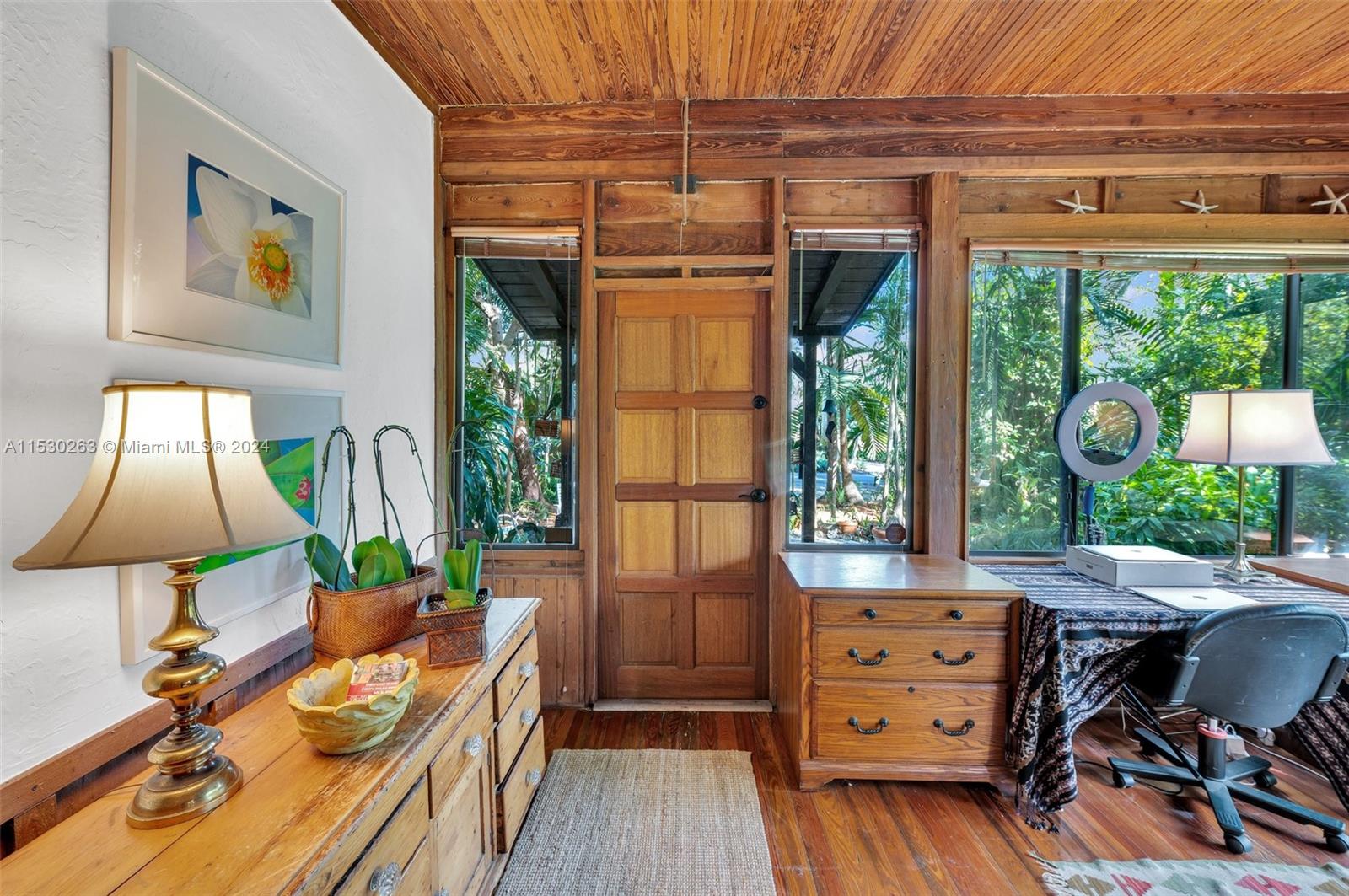 The office large window overlooking the tropical garden will sooth you.