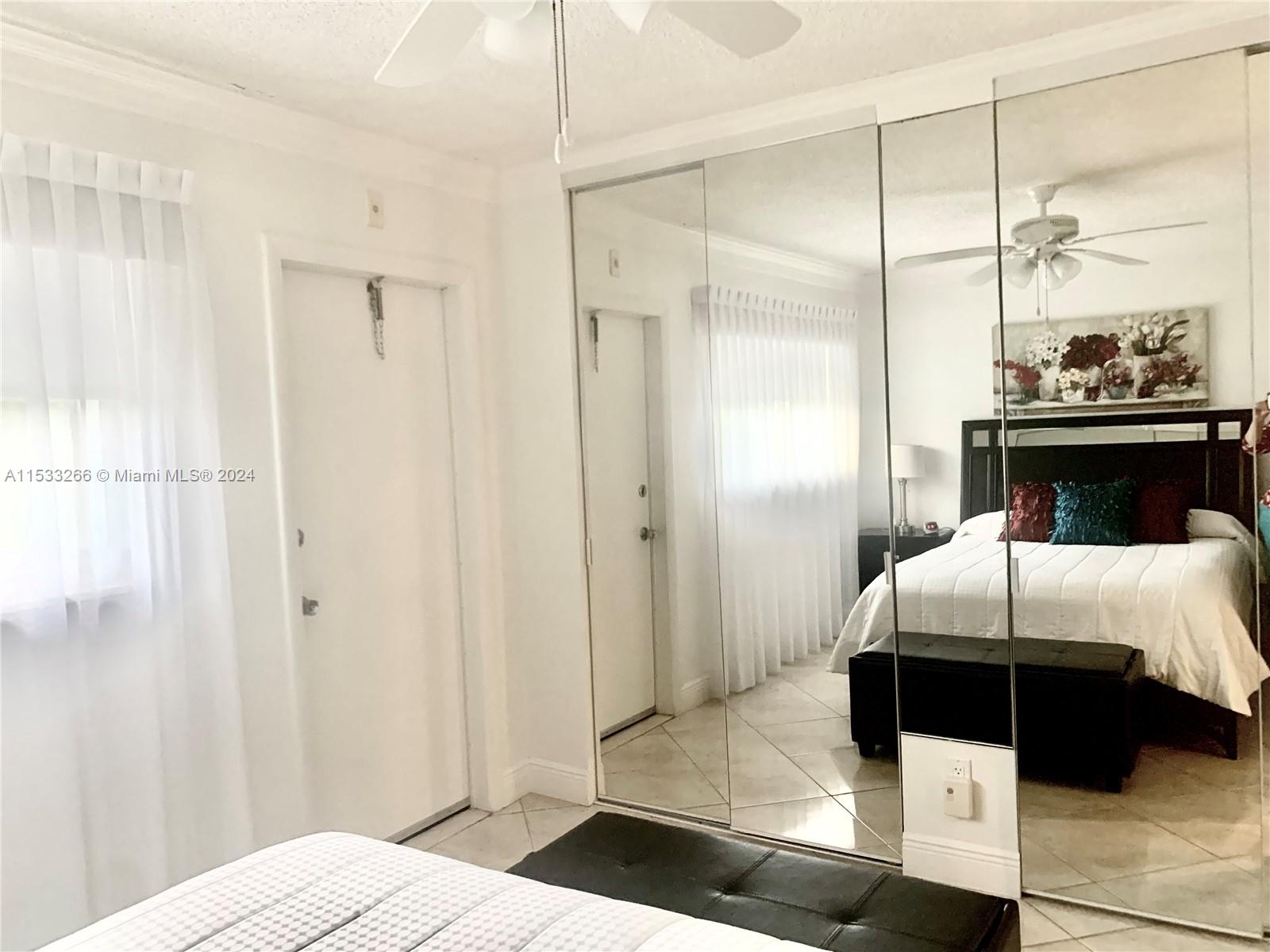 MIRRORED WALL TO WALL CLOSET SPACE