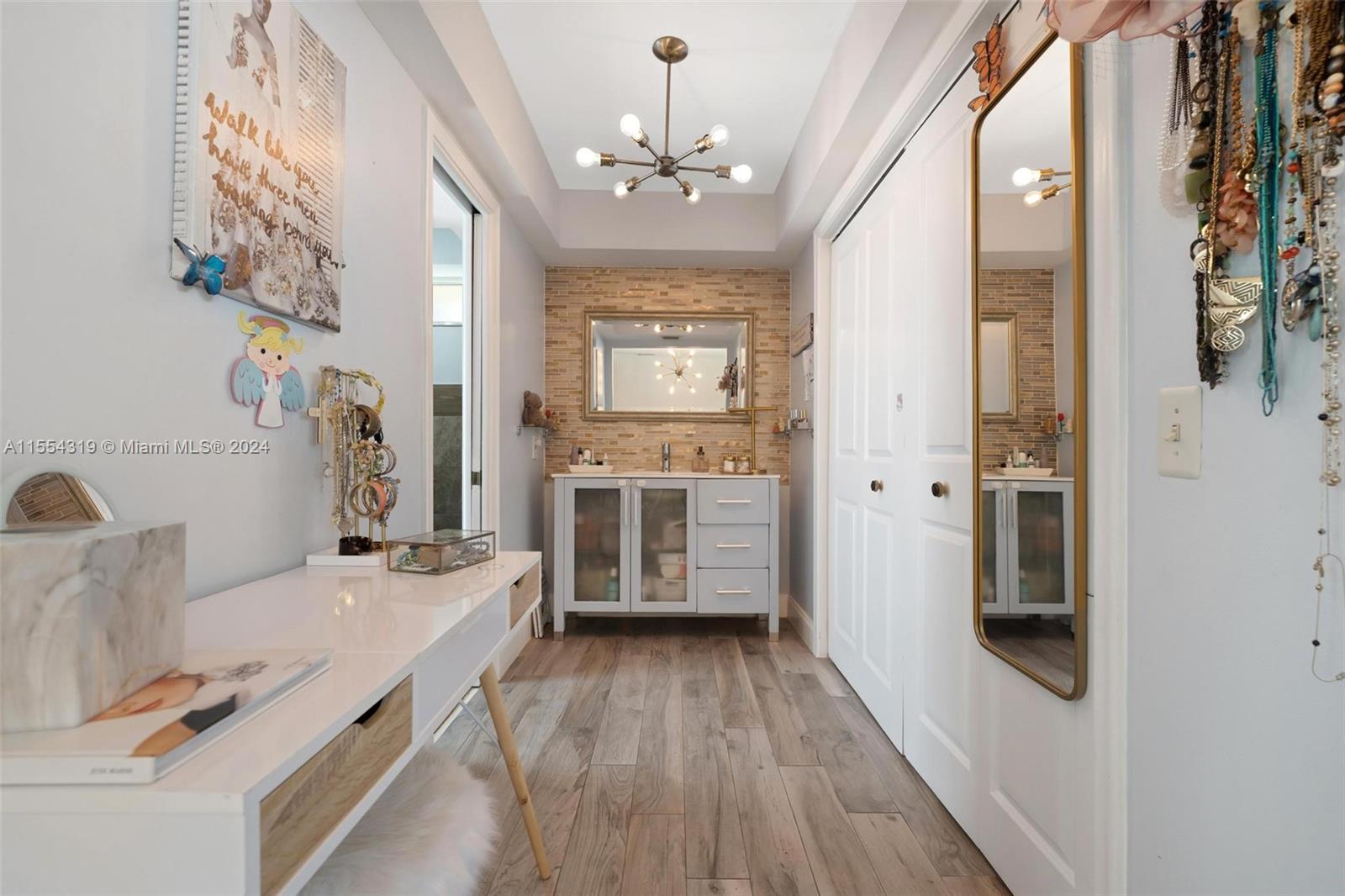 Just off the master bedroom is a large walkin closet and master bath sink/vanity area.