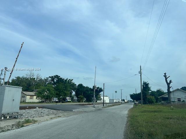 Land is on the right side, on the left there is the Railroad crossing.