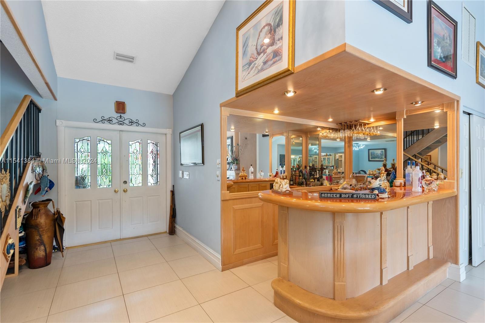 Wet bar off entry way leading to living room.