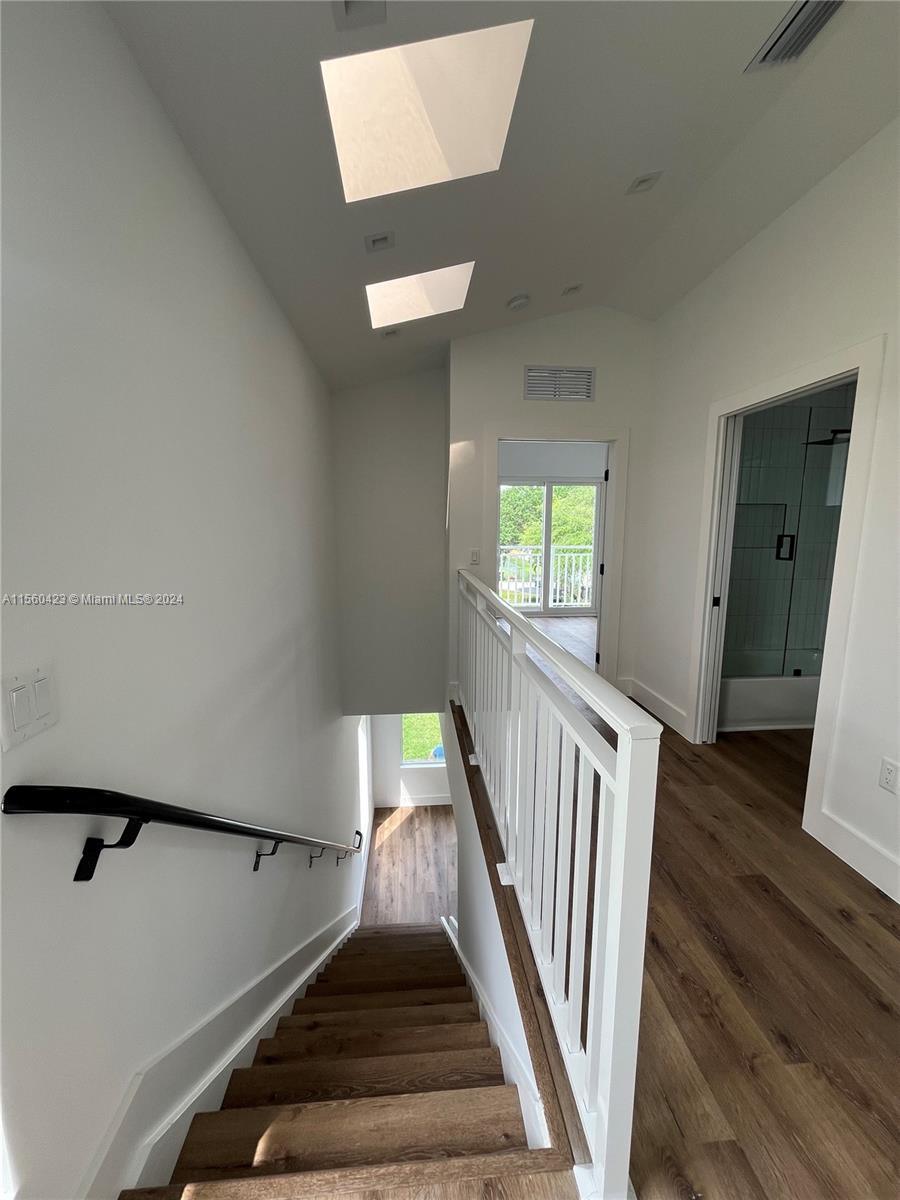 Upstairs hallway and stairs leading downstairs