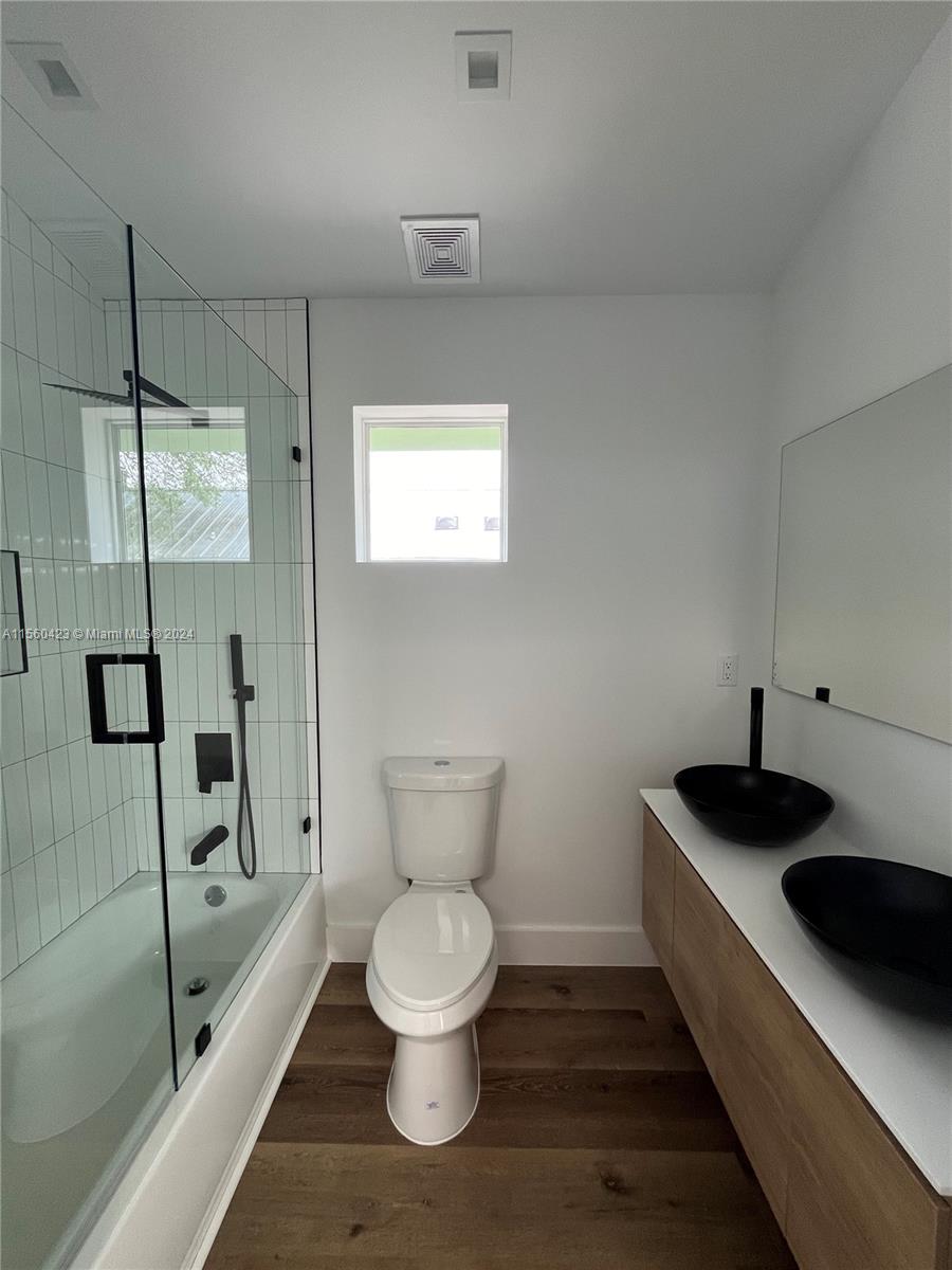 Upstairs bathroom with shower/bathtub and double vanity