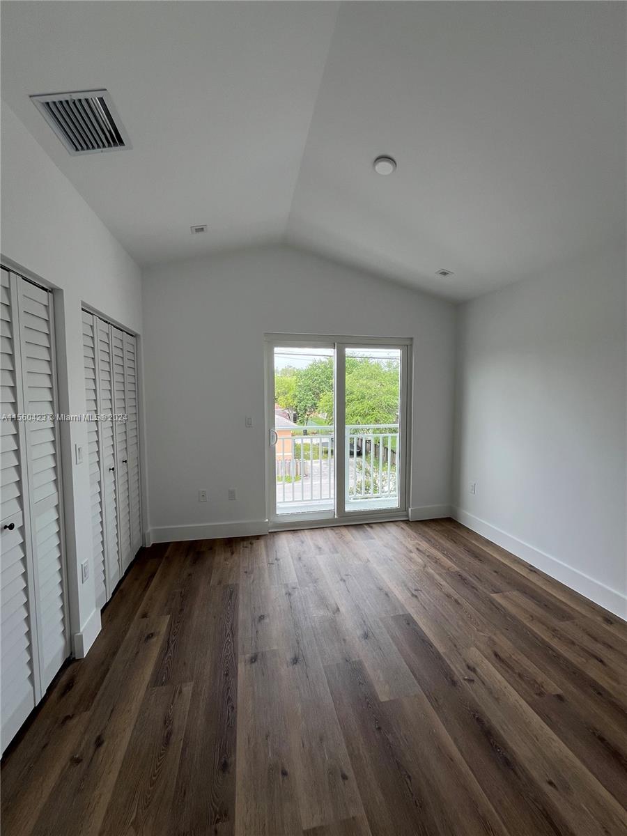 Upstairs bedroom with balcony access