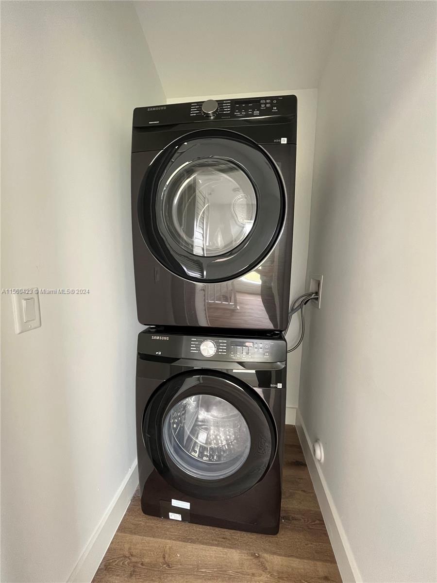Laundry room upstairs with brand new washer and dryer, space for storage