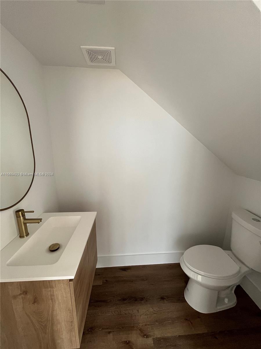 Powder room on first floor off dining area