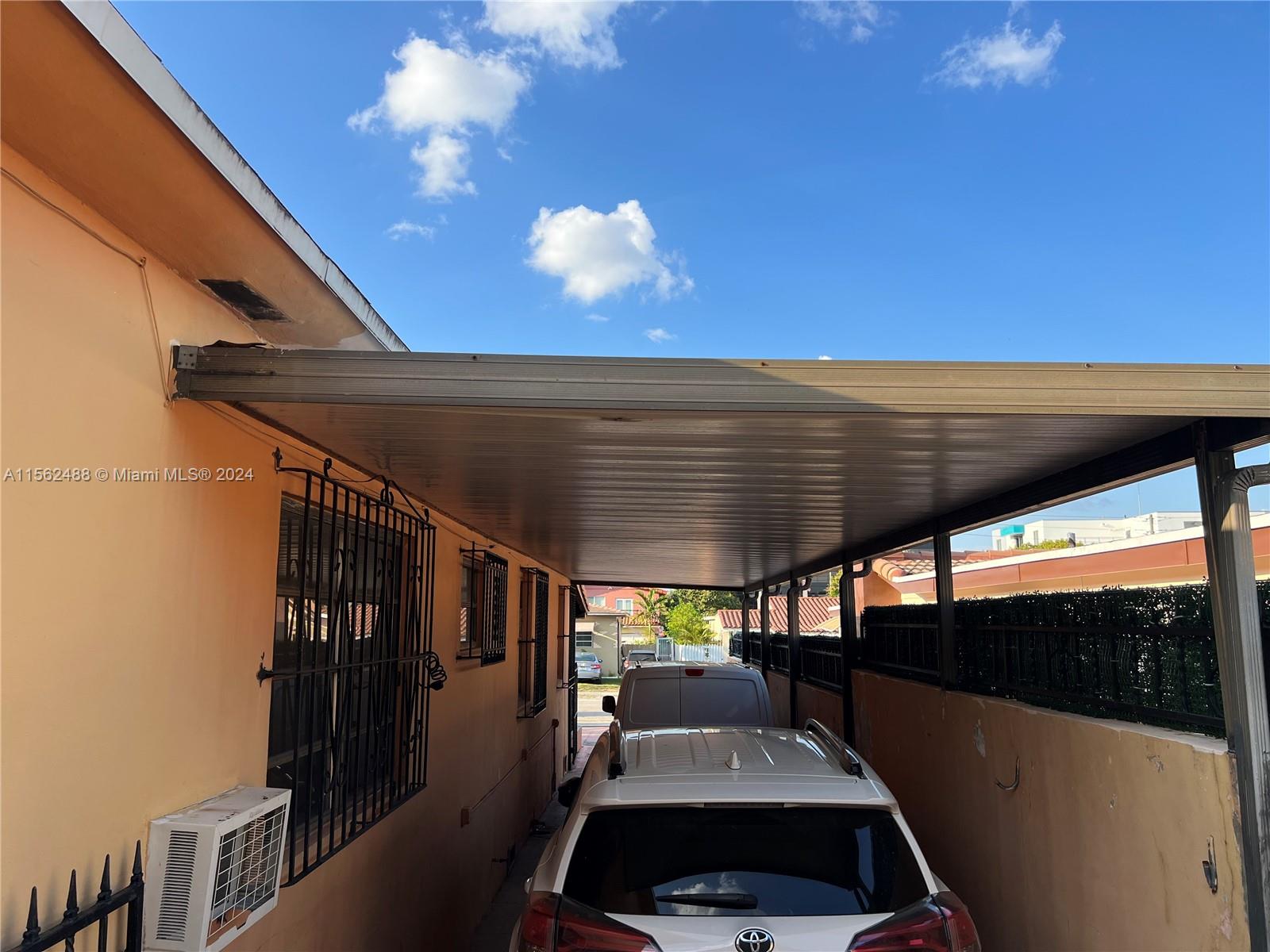Carport accommodates three cars