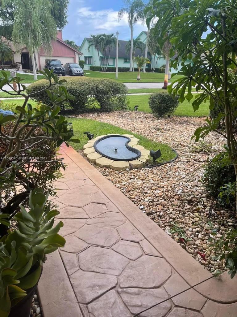 Front walkway with view of pond