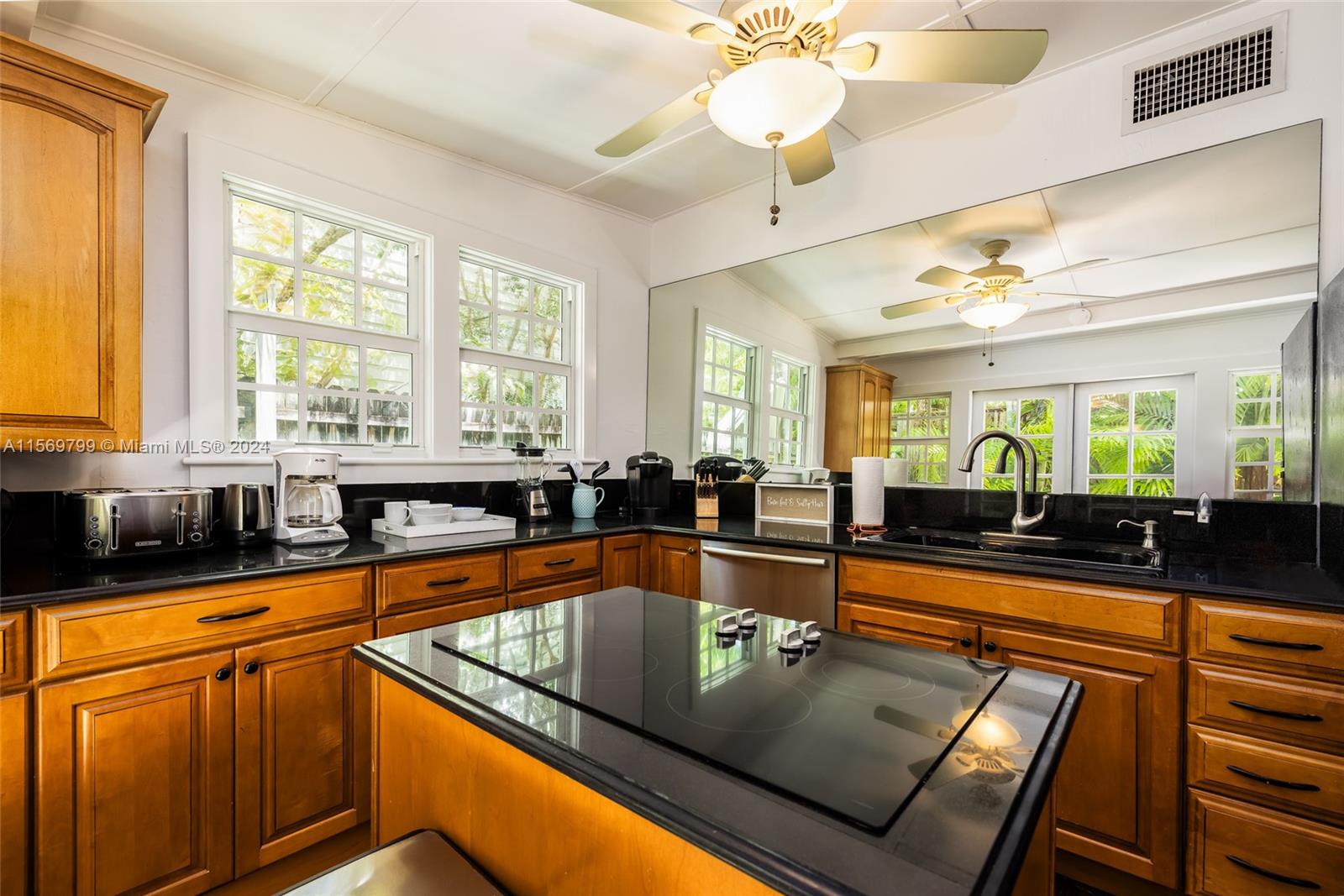 Unleash your culinary prowess in this large chef's Kitchen with French Doors out to the Deck.