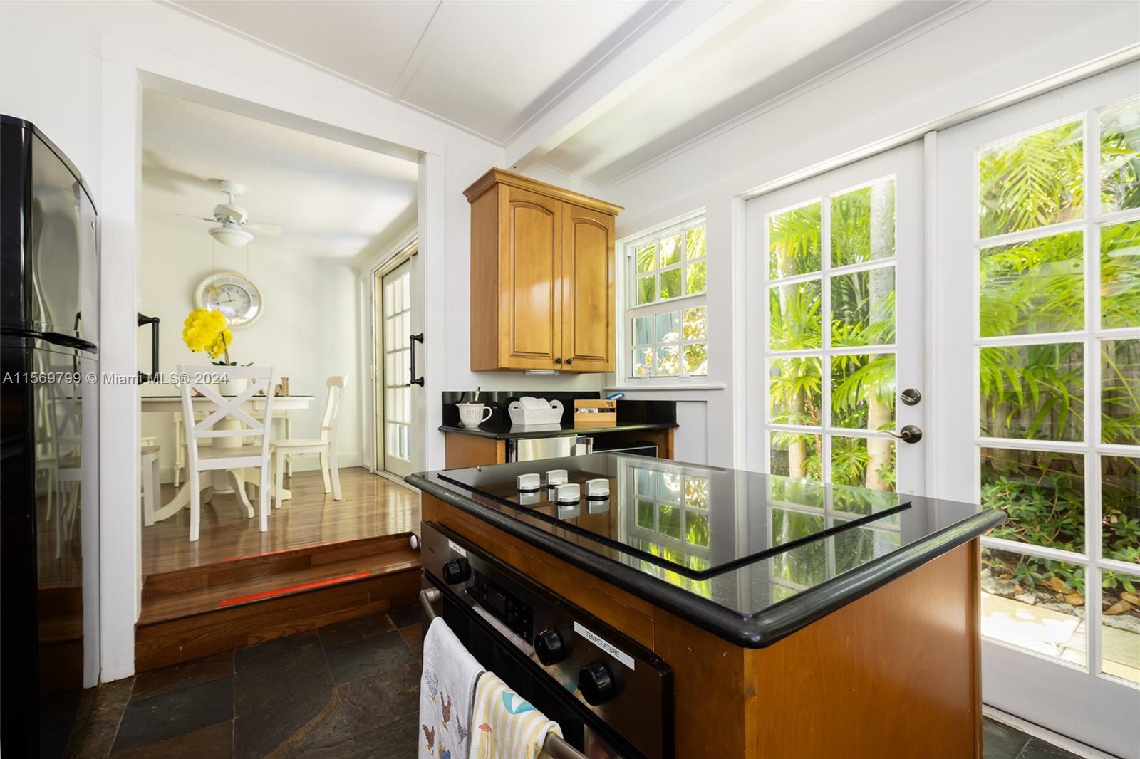 Unleash your culinary prowess in this large chef's Kitchen with French Doors out to the Deck.