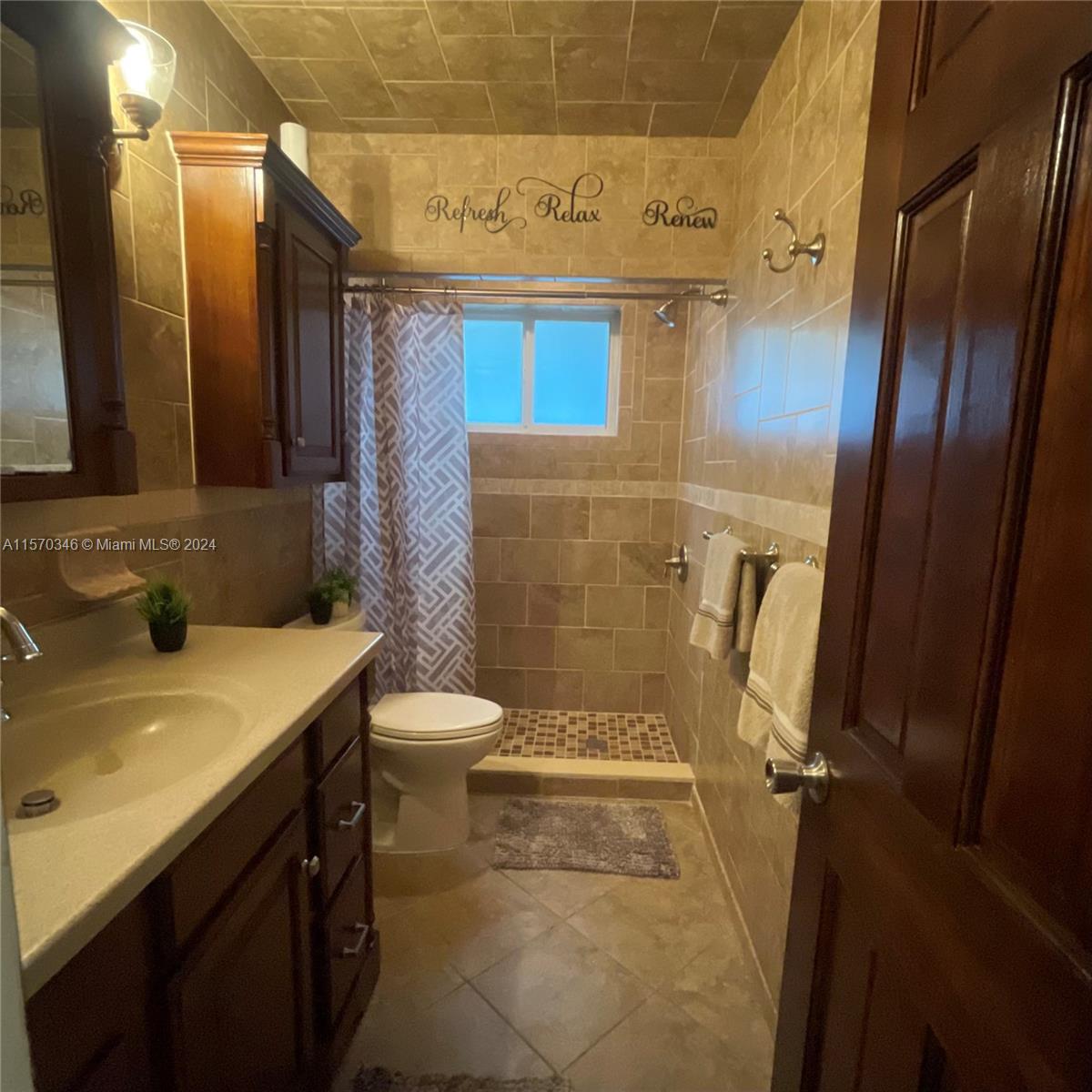 Enter a welcoming spa-like oasis, where relaxation awaits at every turn. Warm lighting and gentle scents invite you to imagine yourself in this serene space. Luxurious touches, from the inviting soaking tub to the sleek walk-in shower, beckon you to unwind. Picture yourself surrounded by elegant marble and intricate tile, indulging in the tranquility of this intimate sanctuary.
