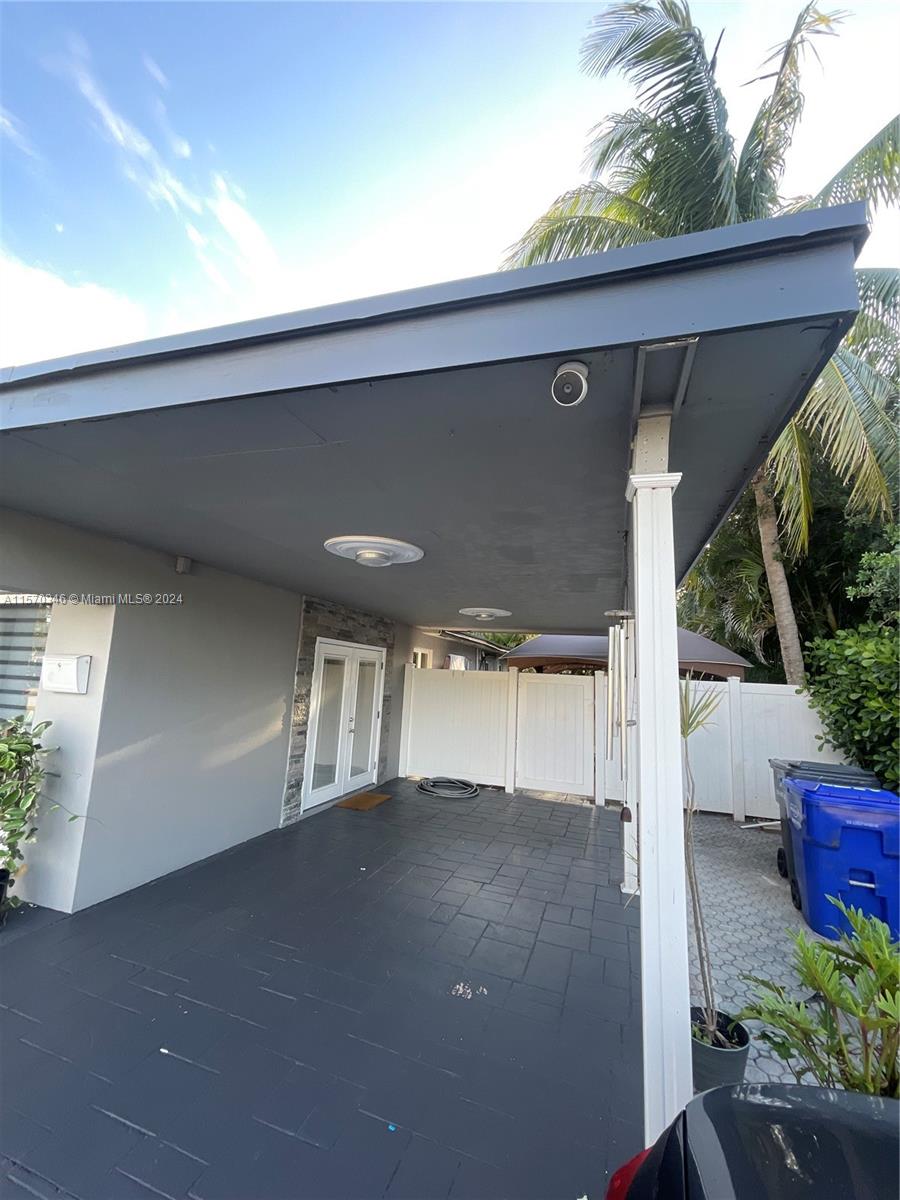 Elevate your lifestyle with the convenience and style of a sleek carport at this remarkable home for sale. Enjoy effortless access and shelter from the elements in unparalleled sophistication.
