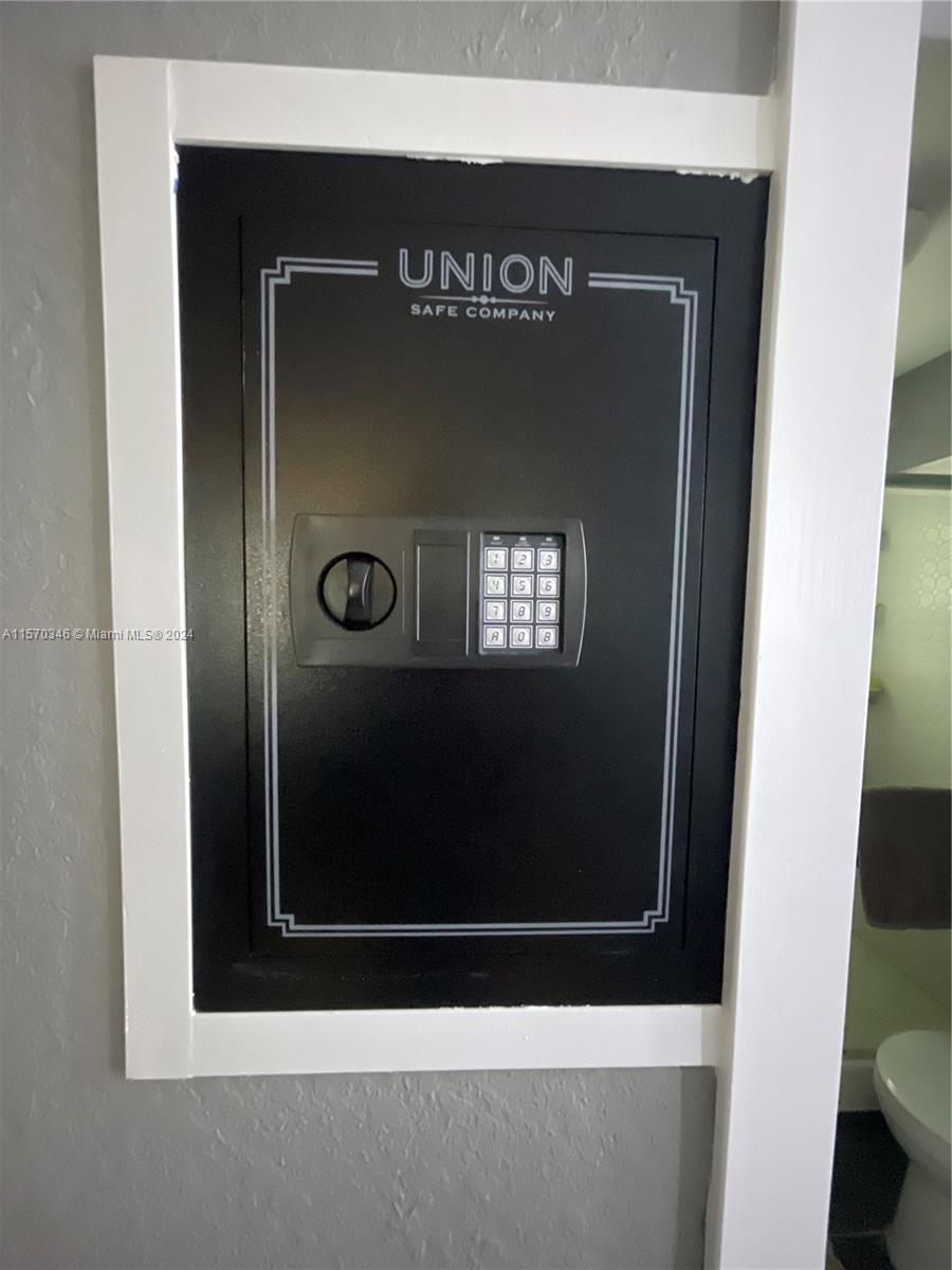Gaze upon the Union Safe, a symbol of security and sophistication in this exquisite home. Though compact, it offers ample space for your treasures. With its resettable code feature, convenience and peace of mind intertwine seamlessly. Embrace the elegance of this Union Safe, a testament to both style and safety.