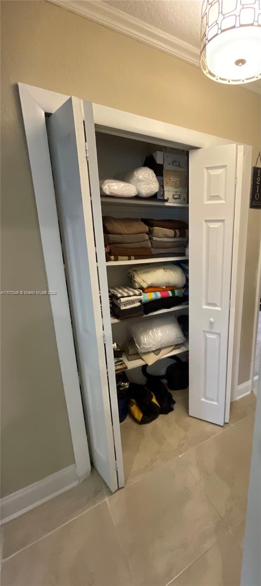 Discover the convenience of our linen closet nestled in the common hallway. With ample space and additional storage, it's an organizer's dream come true.