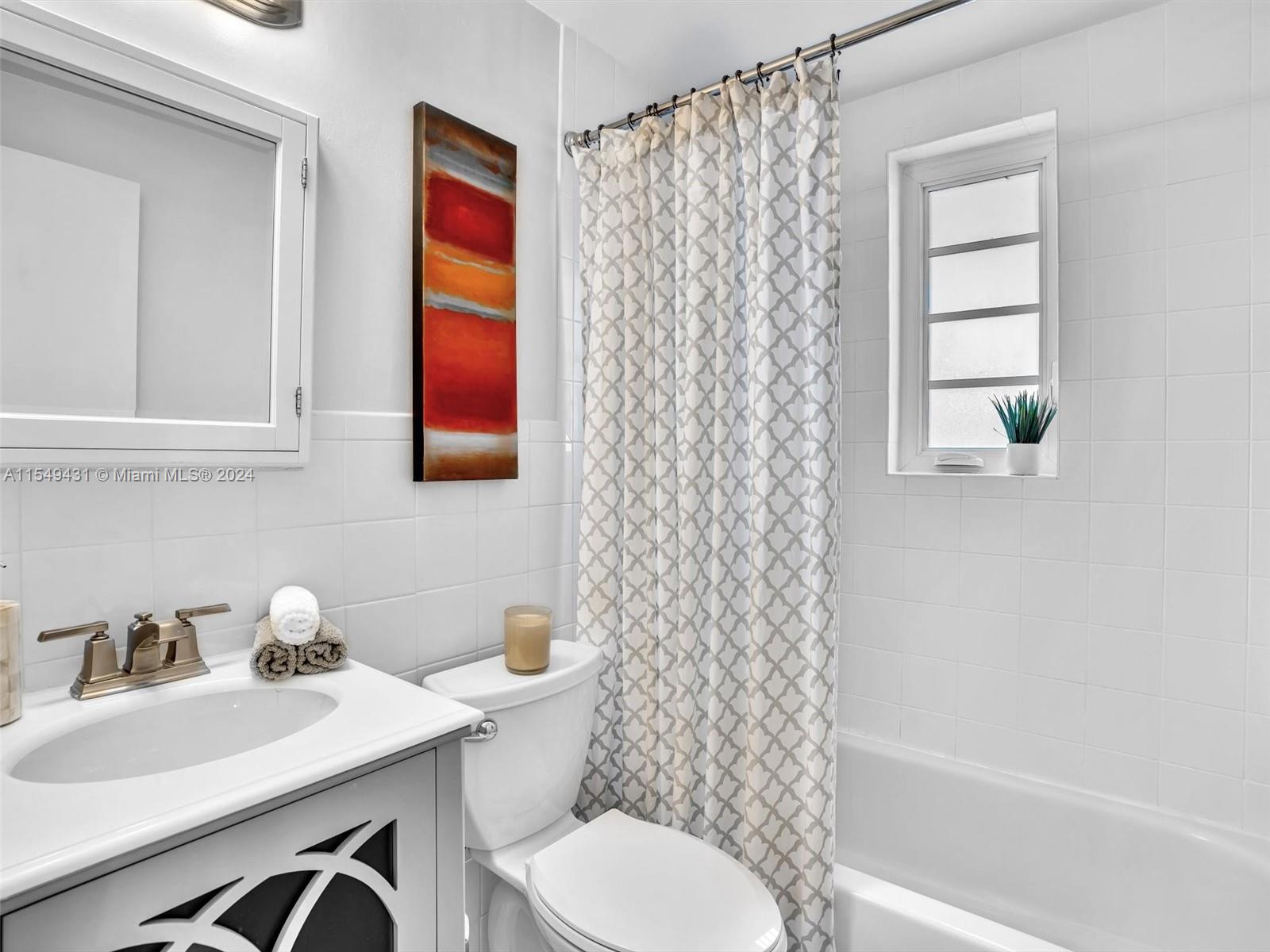 Upgraded bath with tub and shower.