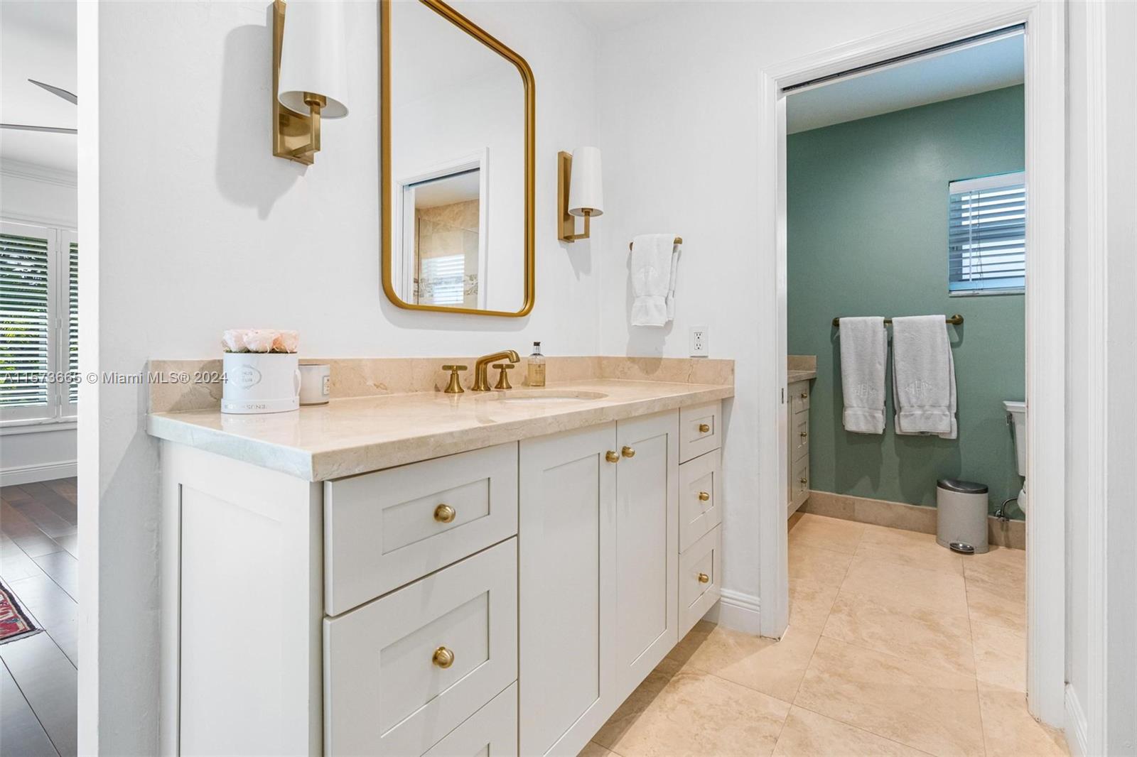 Primary bathroom features 2 separate vanities.