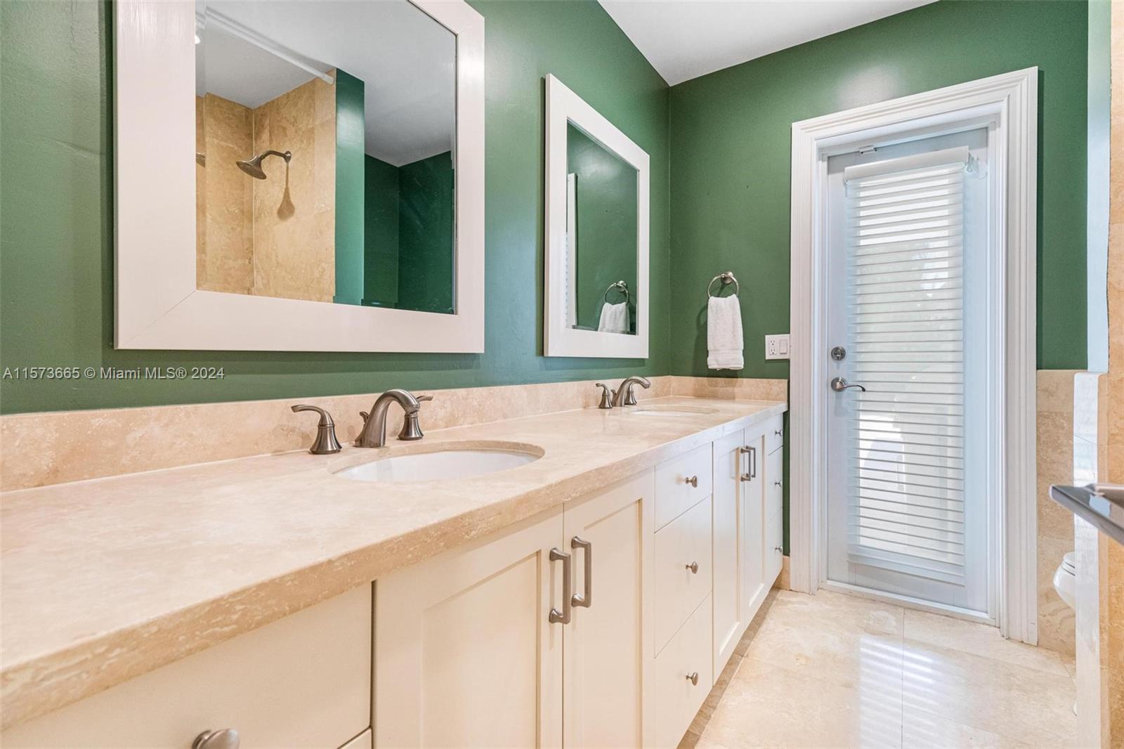 Hall bathroom serves as cabana bath to pool area, and features a tub/shower combo