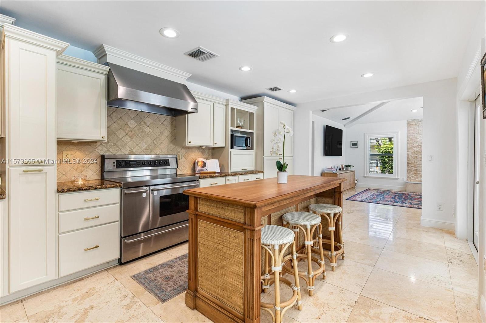 Kitchen flows from dining area into family room