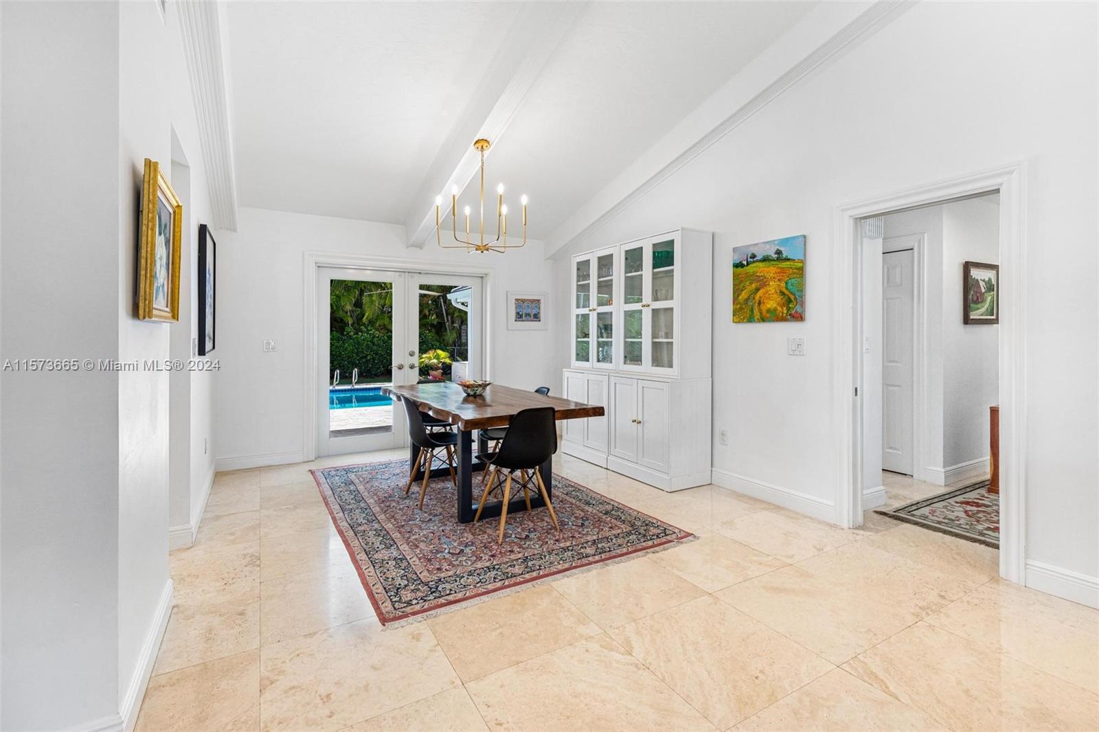 French doors lead from dining area to covered patio