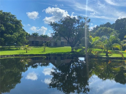 Pond is located in the front of the home set back closer to the street