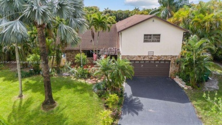 Two story home in Central Plantation Acres